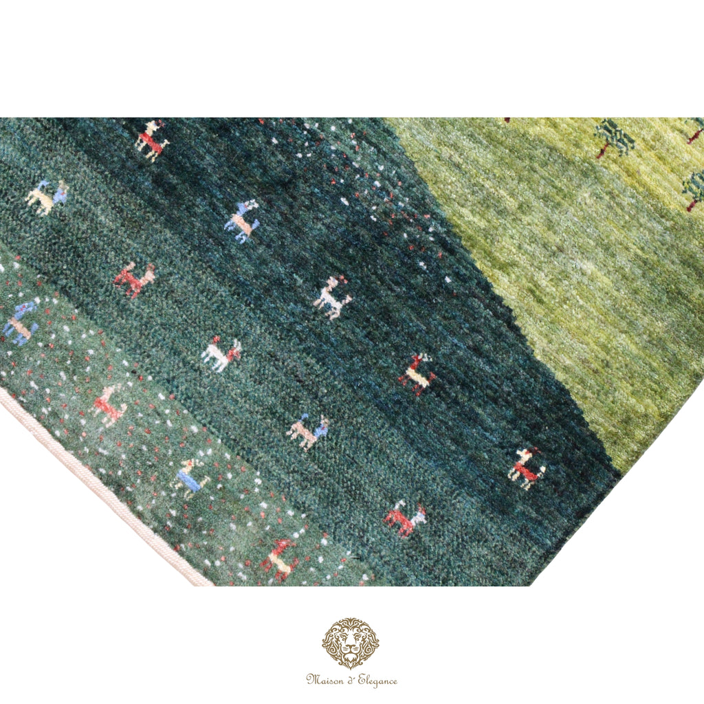 Close-up of a patterned rug with small figures on a green background