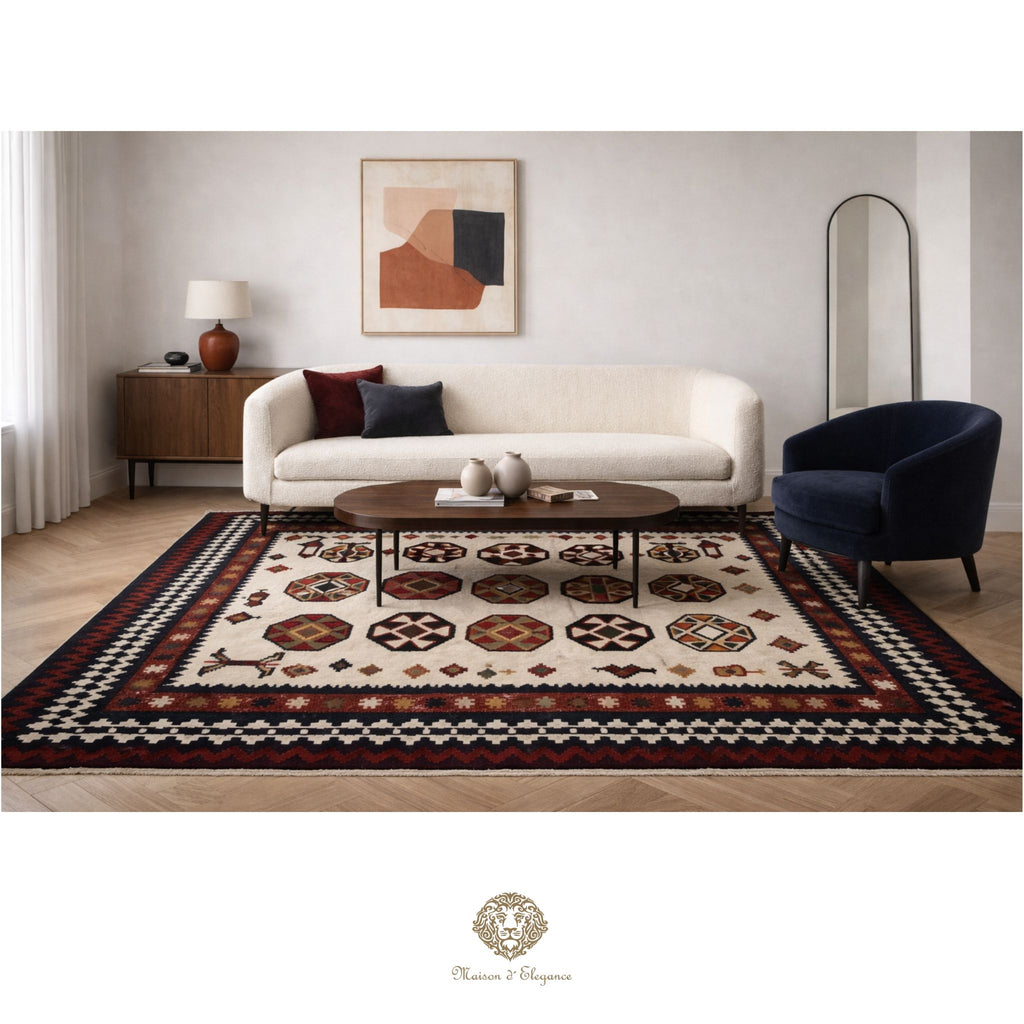 Living room with a patterned rug, sofa, and armchair.