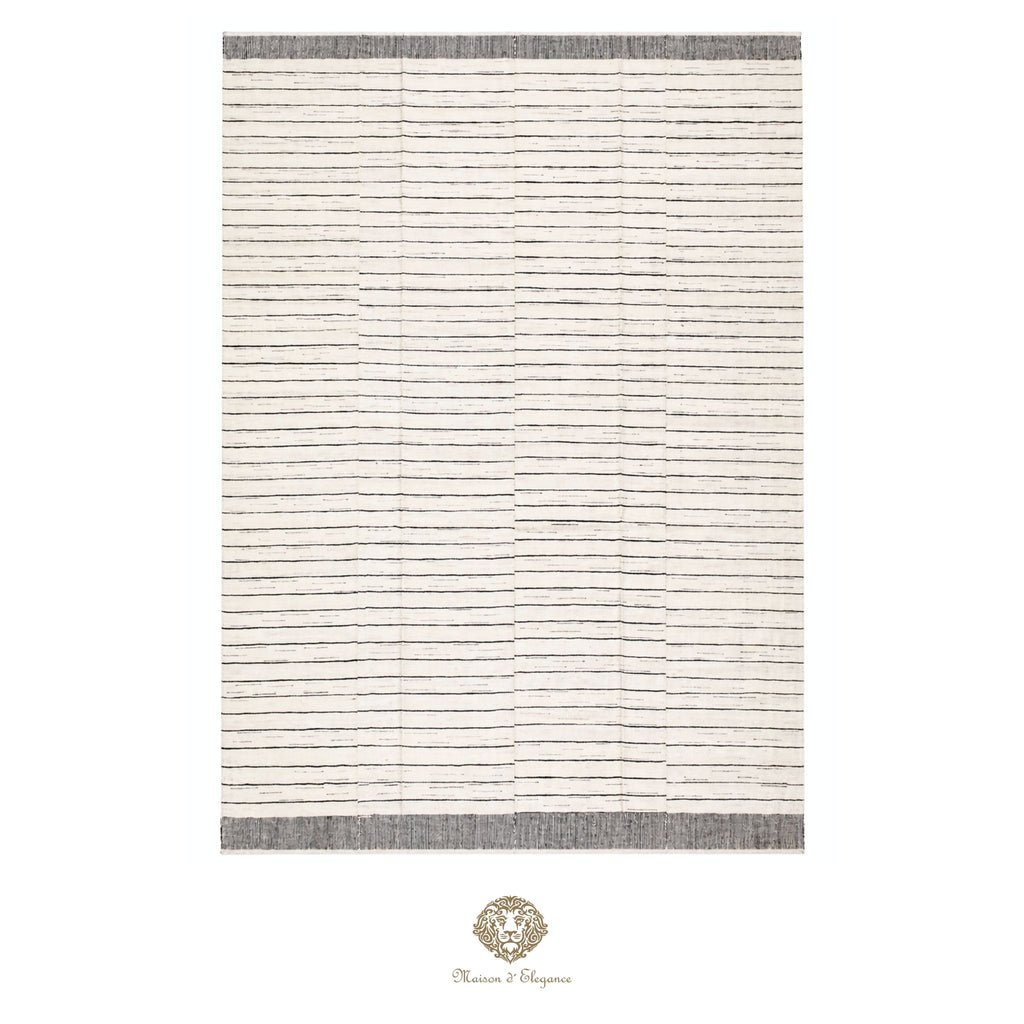 Striped rug with a brand logo at the bottom right corner on a white background