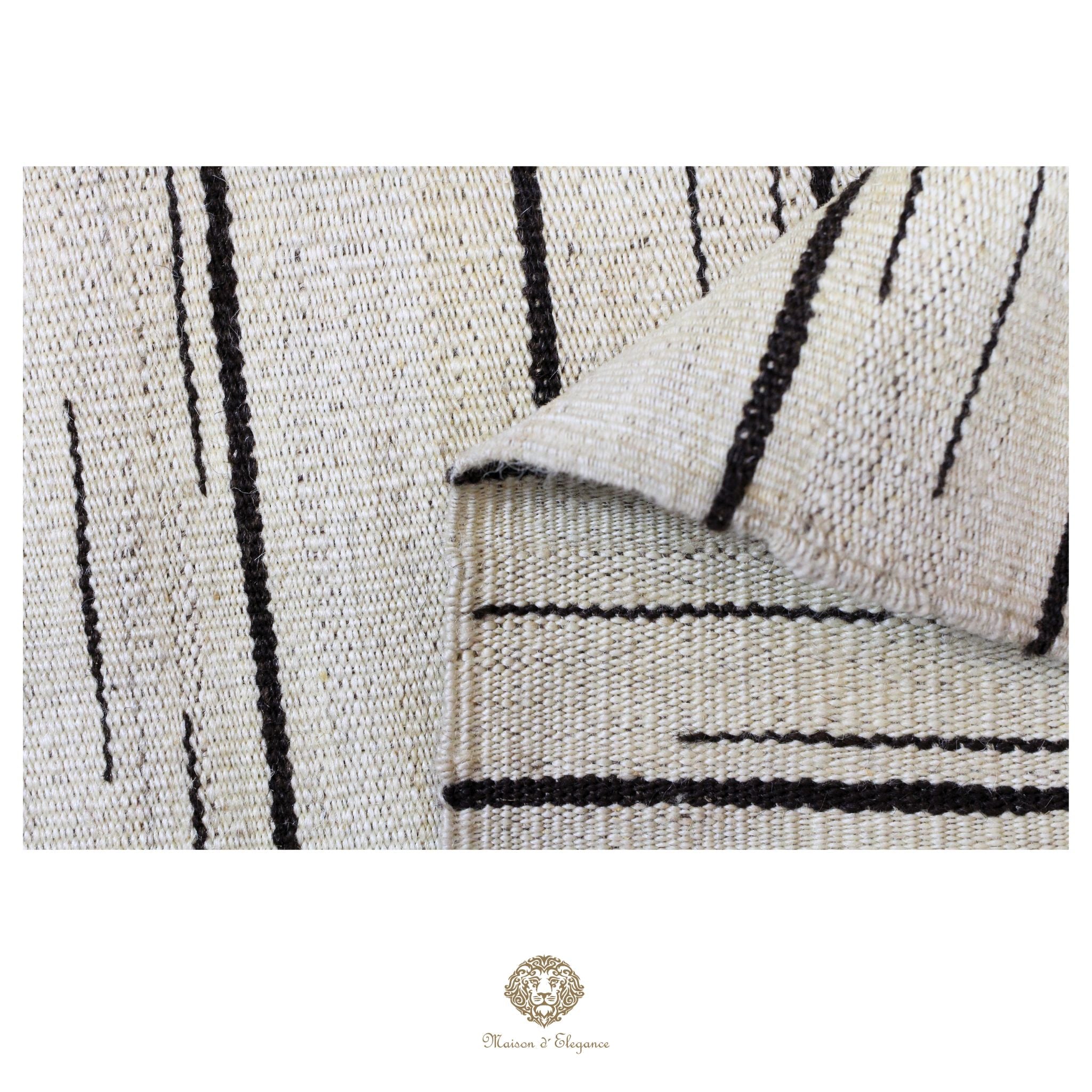 Close-up of a textured rug with black lines on a white background