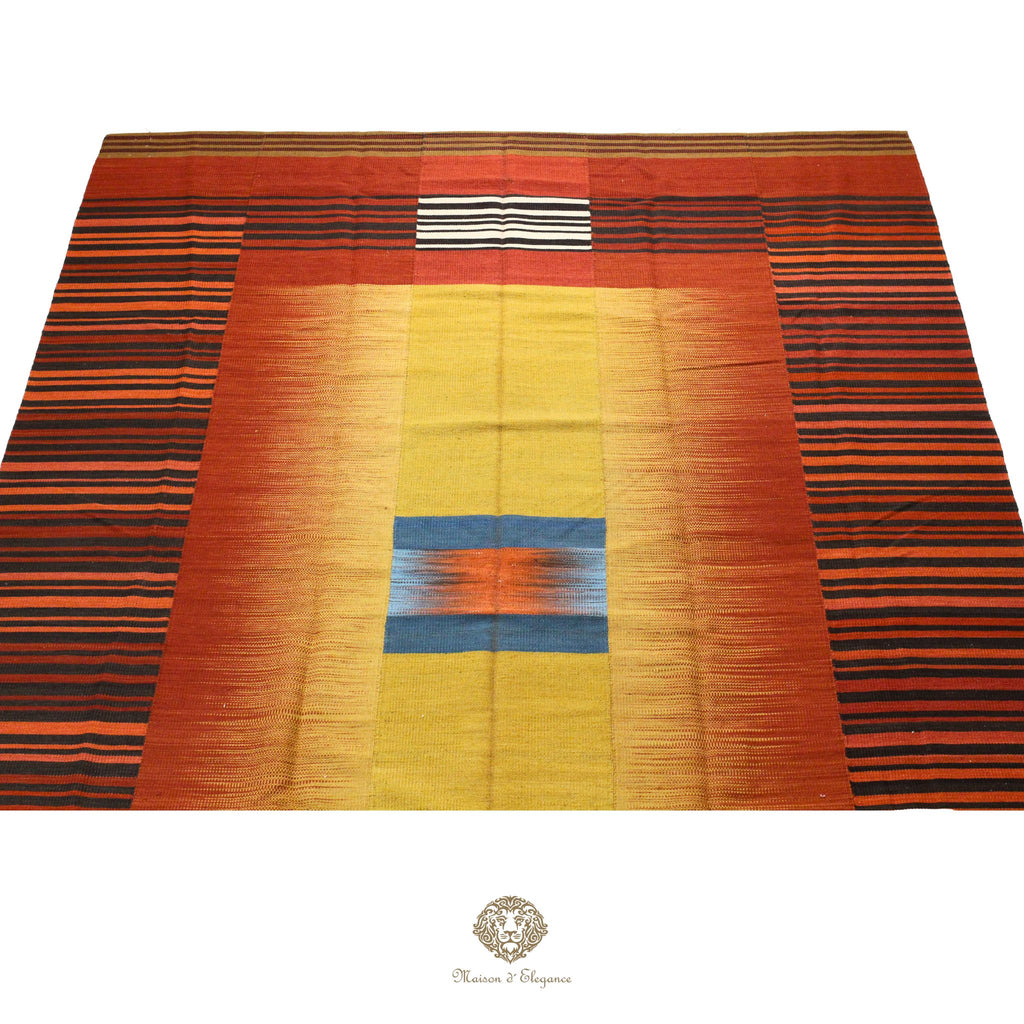 Colorful woven fabric with horizontal stripes on a orange background