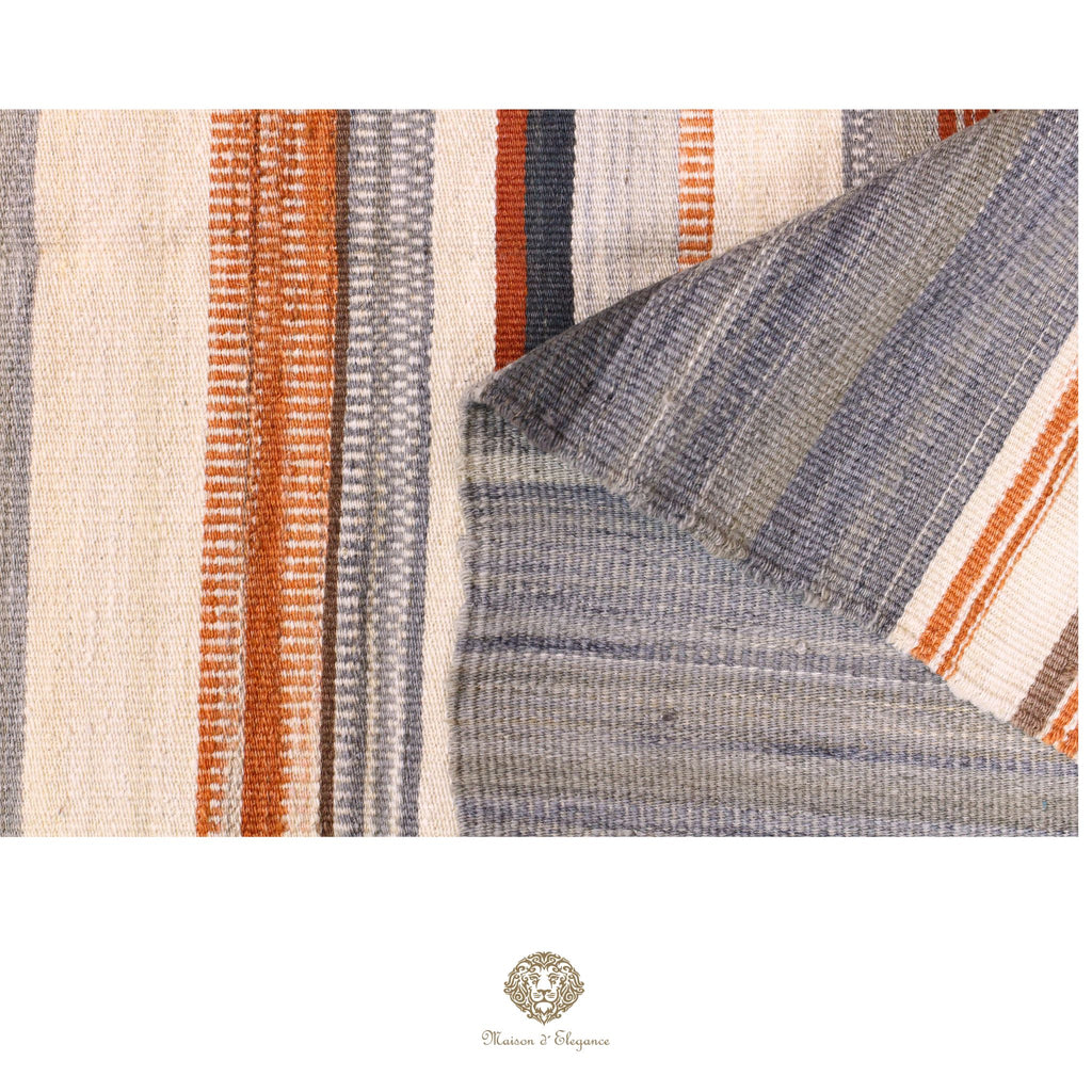 Close-up of a textured fabric with striped pattern in neutral colors.