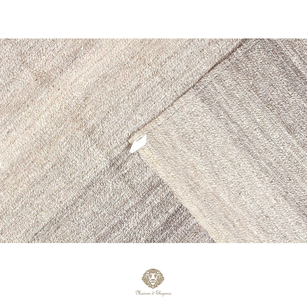 Textured fabric with a subtle pattern on a white background