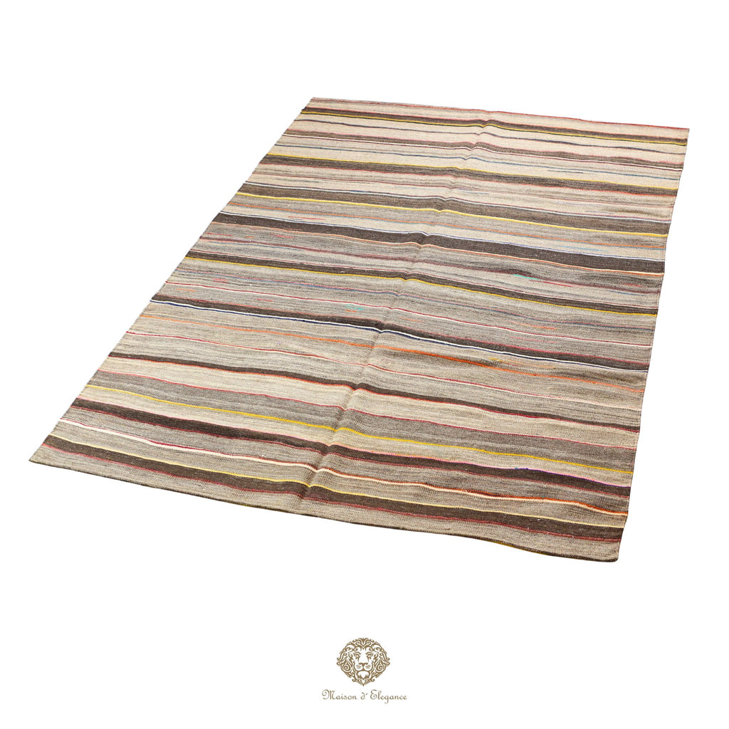 Striped rug with multicolor pattern on a khaki background