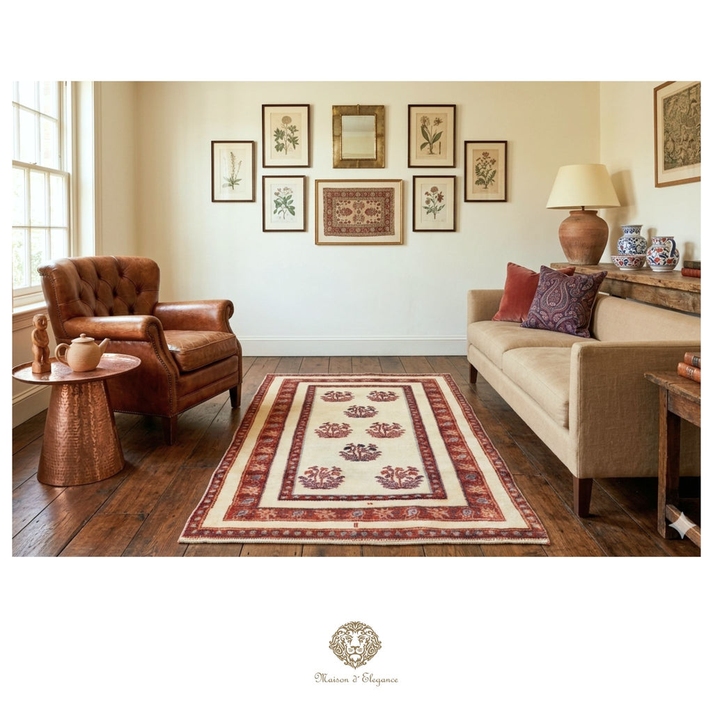 Living room with a patterned rug, brown armchair, and beige sofa.
