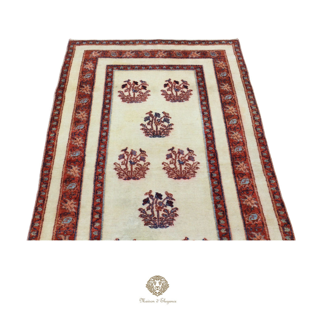 Decorative rug with floral patterns and red border on a white background