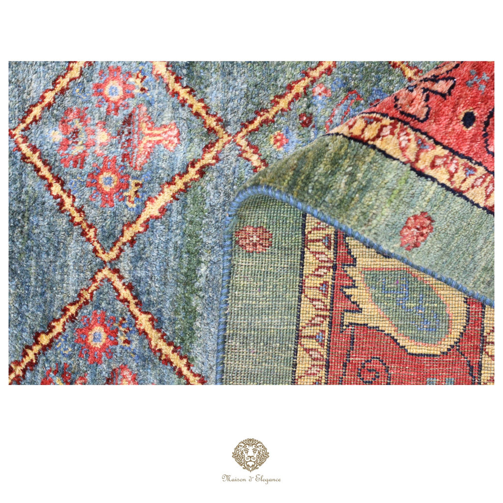 Close-up of a colorful patterned rug with geometric and floral designs.