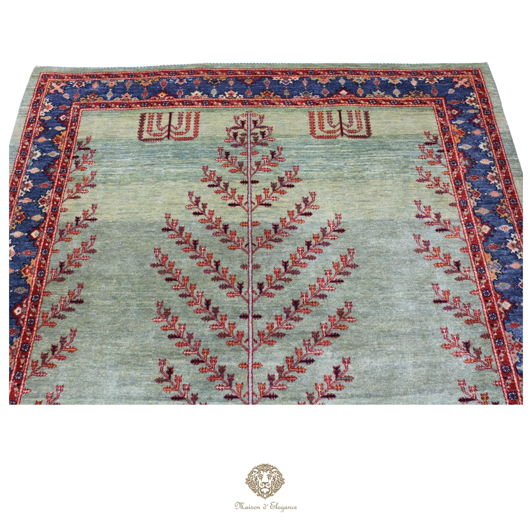 Decorative rug with intricate patterns on a verde background