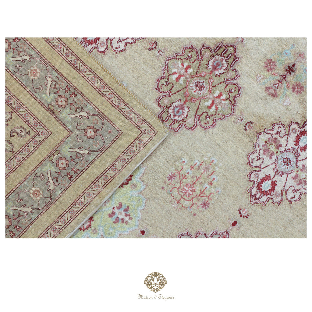 Close-up of a patterned rug with floral designs on a beige background