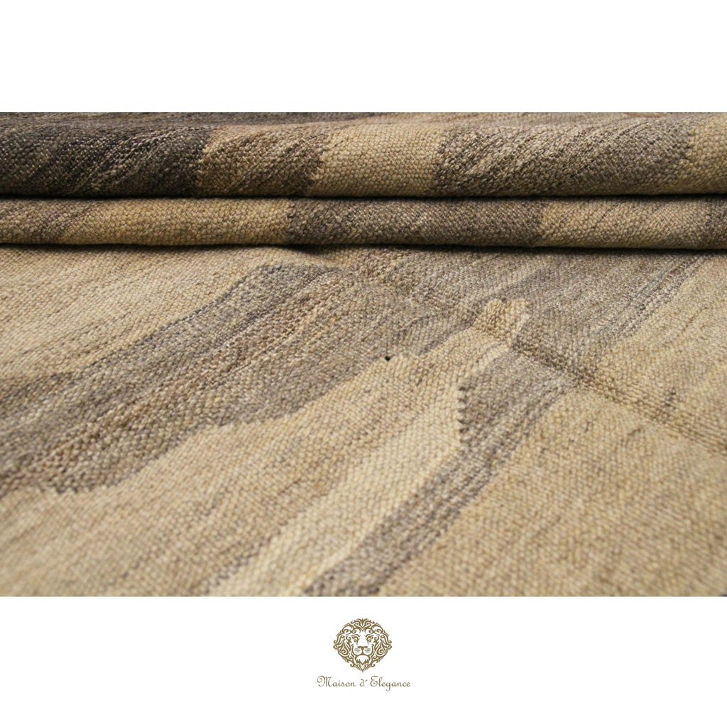 Close-up of textured fabric with a pattern, featuring shades of brown and beige.