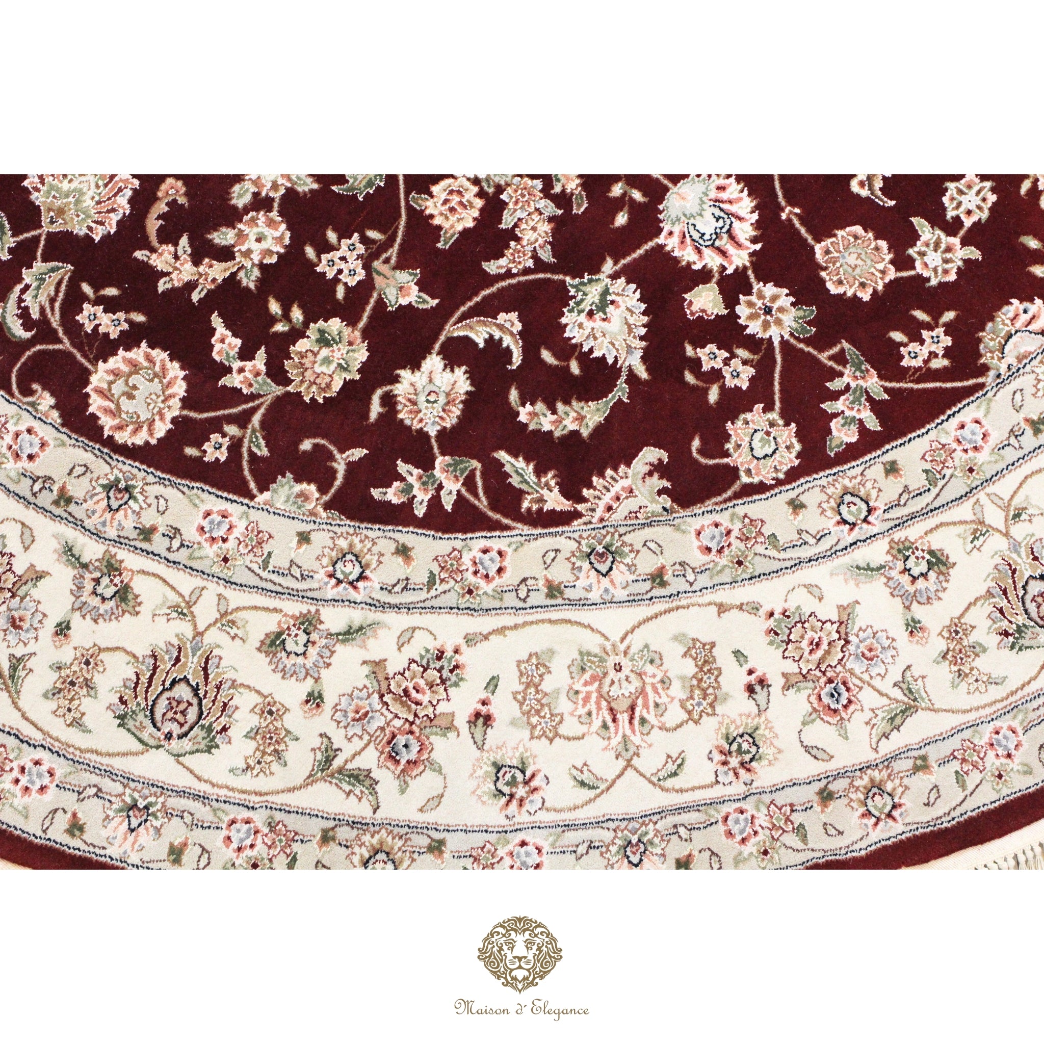 Close-up of a floral-patterned rug with intricate designs on a red background.