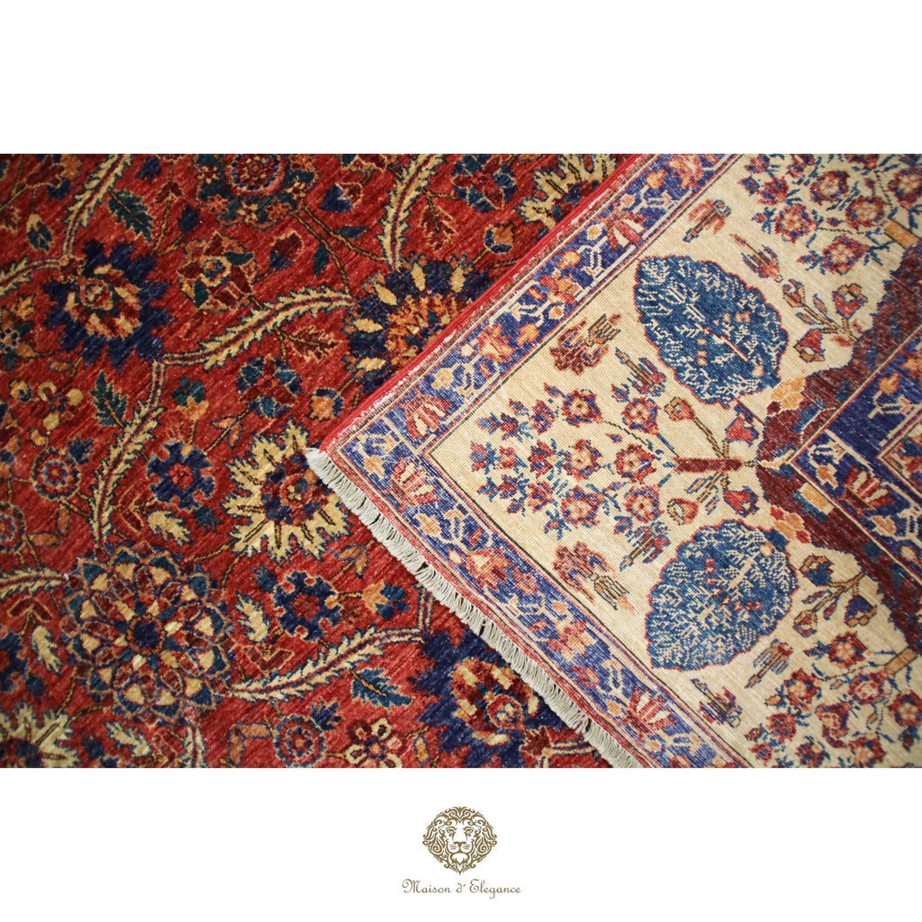 Close-up of two patterned rugs with a visible brand logo at the bottom.