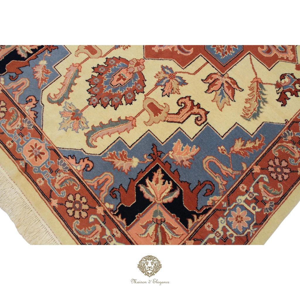 Close-up of a patterned rug with intricate designs on a Ivory background