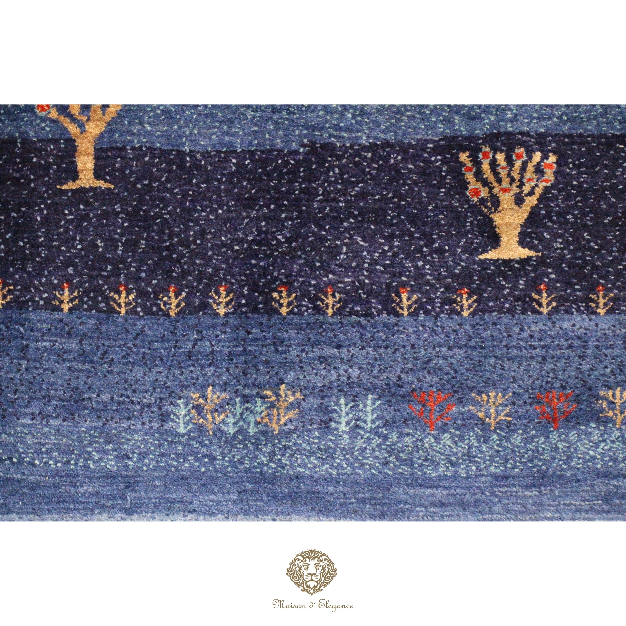 Textile with tree patterns on a blue background, featuring a brand logo at the bottom.