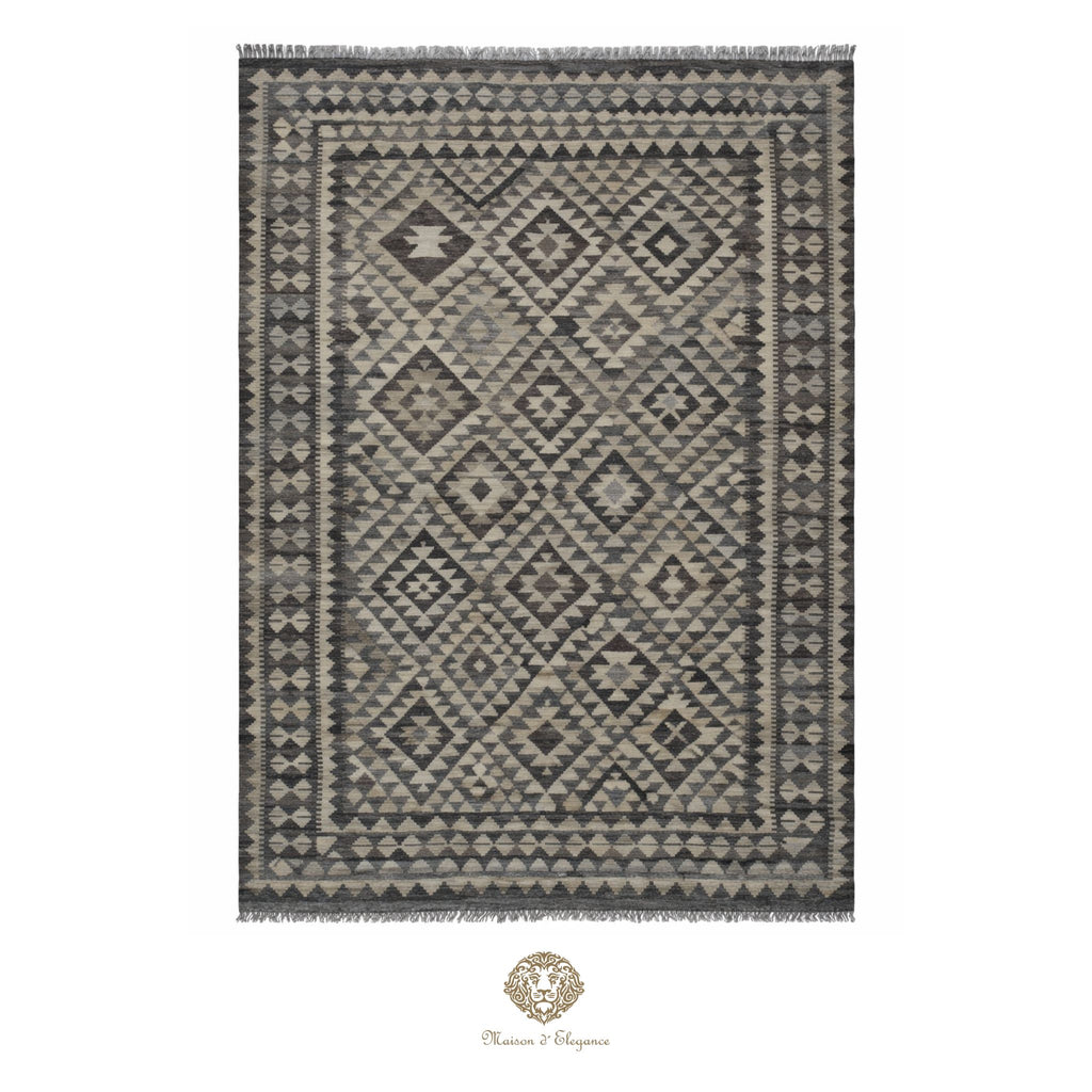 Patterned rug with geometric design on a white background, featuring the brand 'Chandra Rugs'.