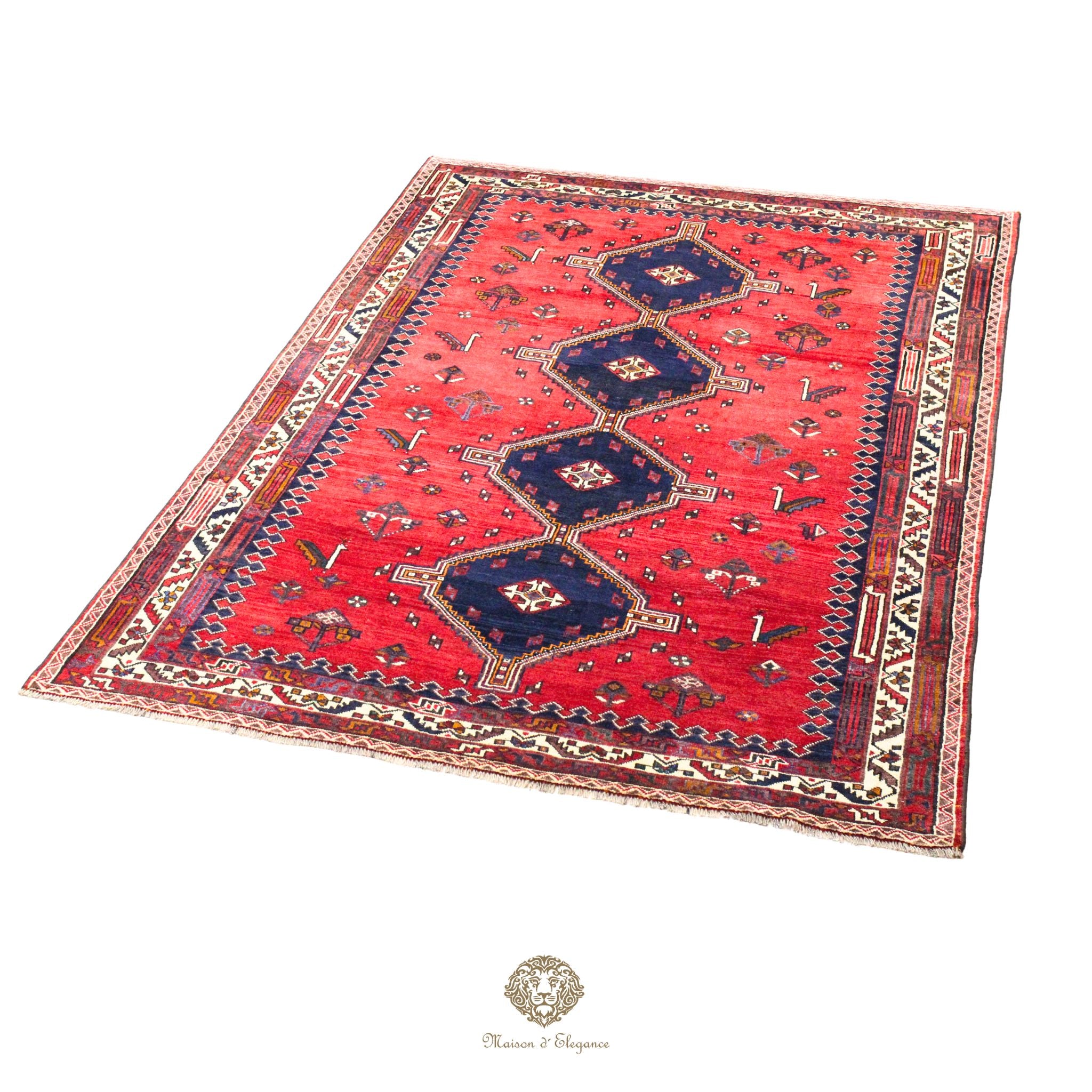 Red patterned rug with blue accents on a red background
