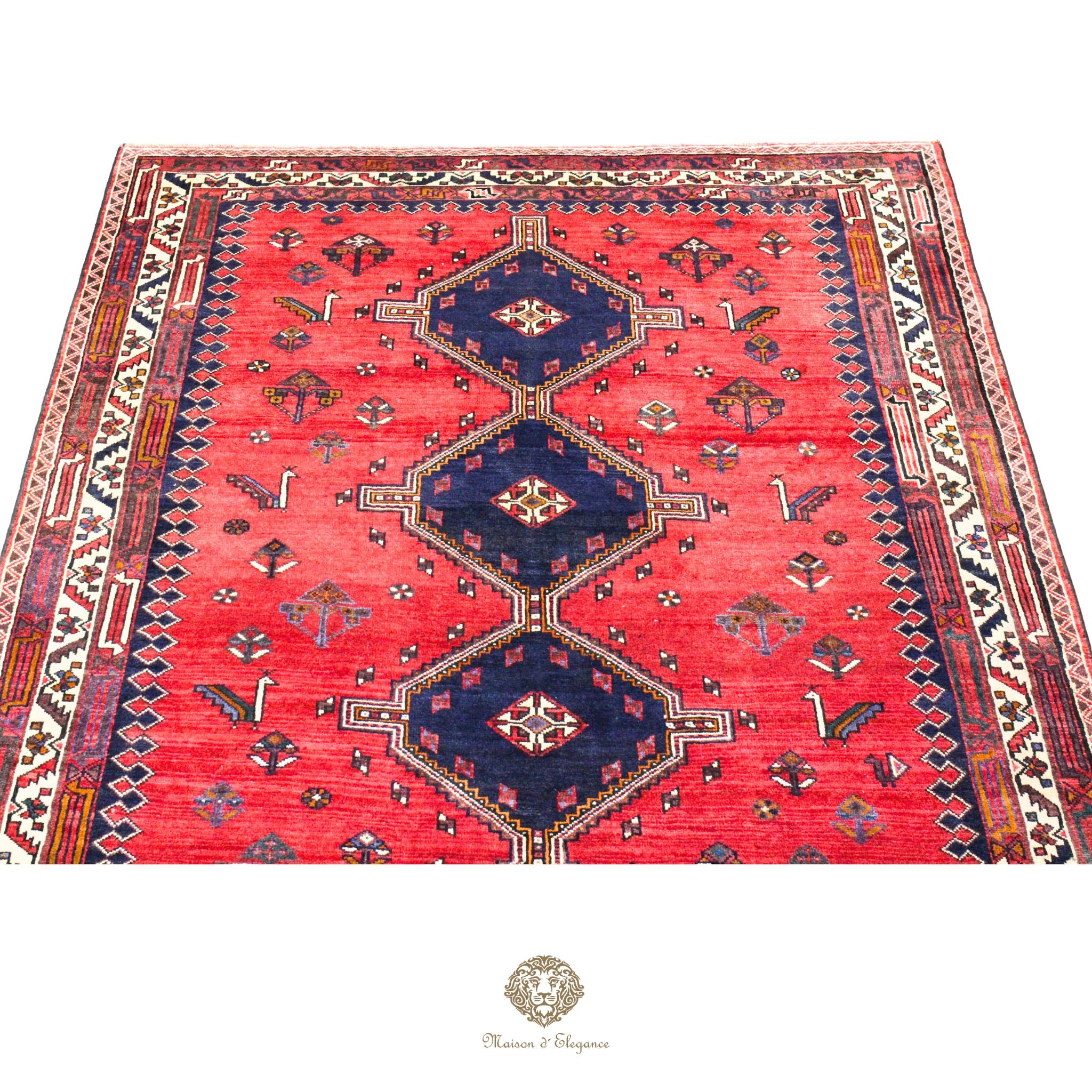 Decorative rug with geometric pattern on a red background