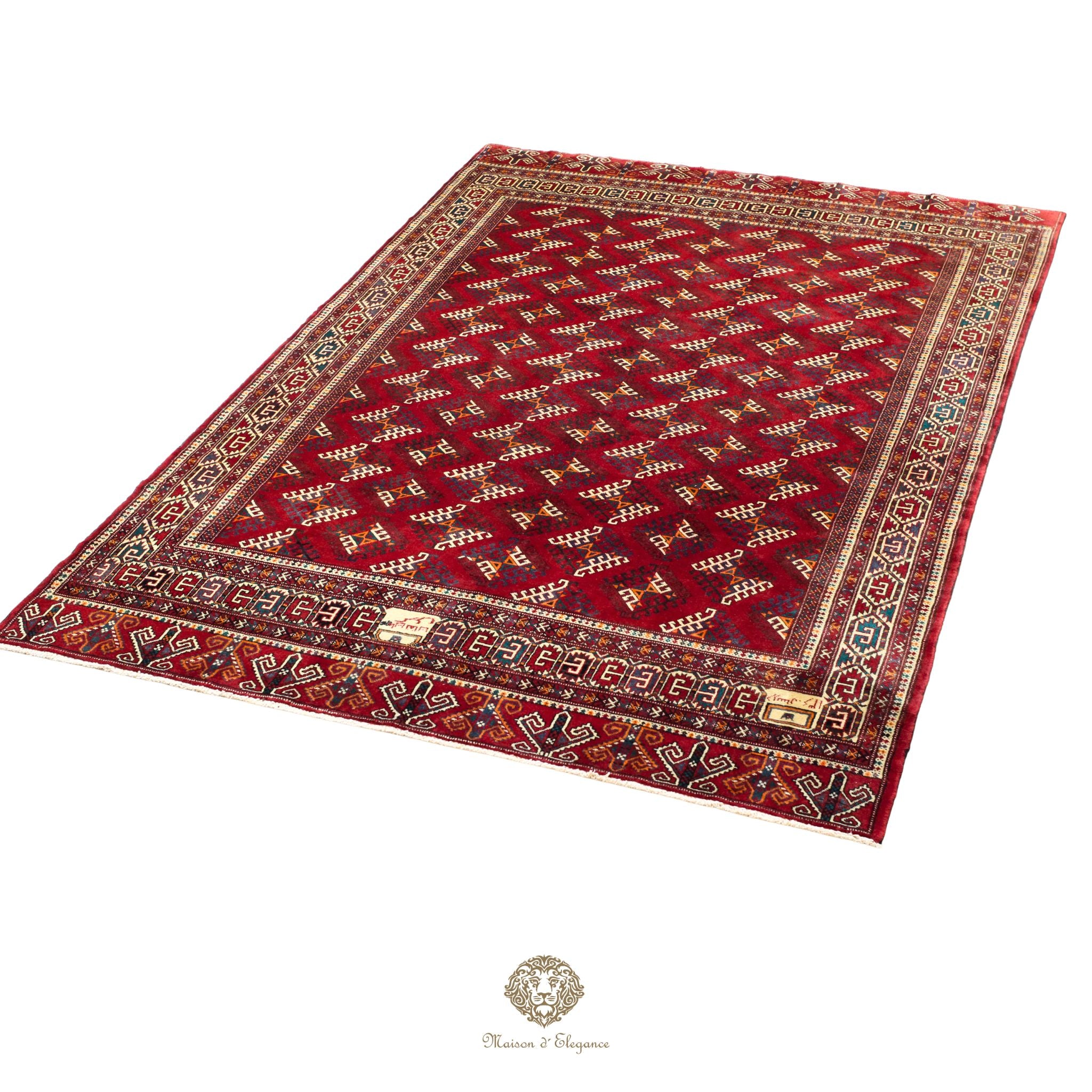 Decorative red rug with intricate patterns on a red background