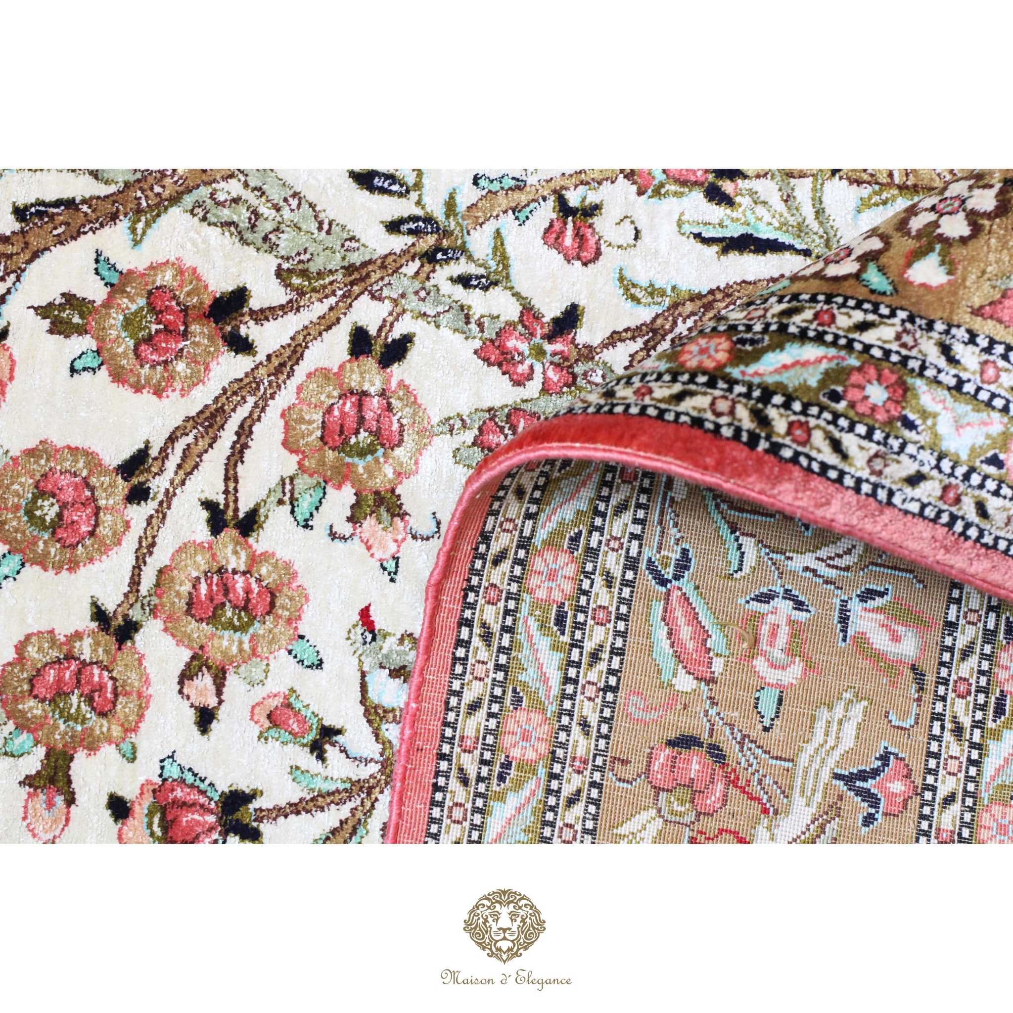Close-up of a floral patterned fabric with a visible brand logo.