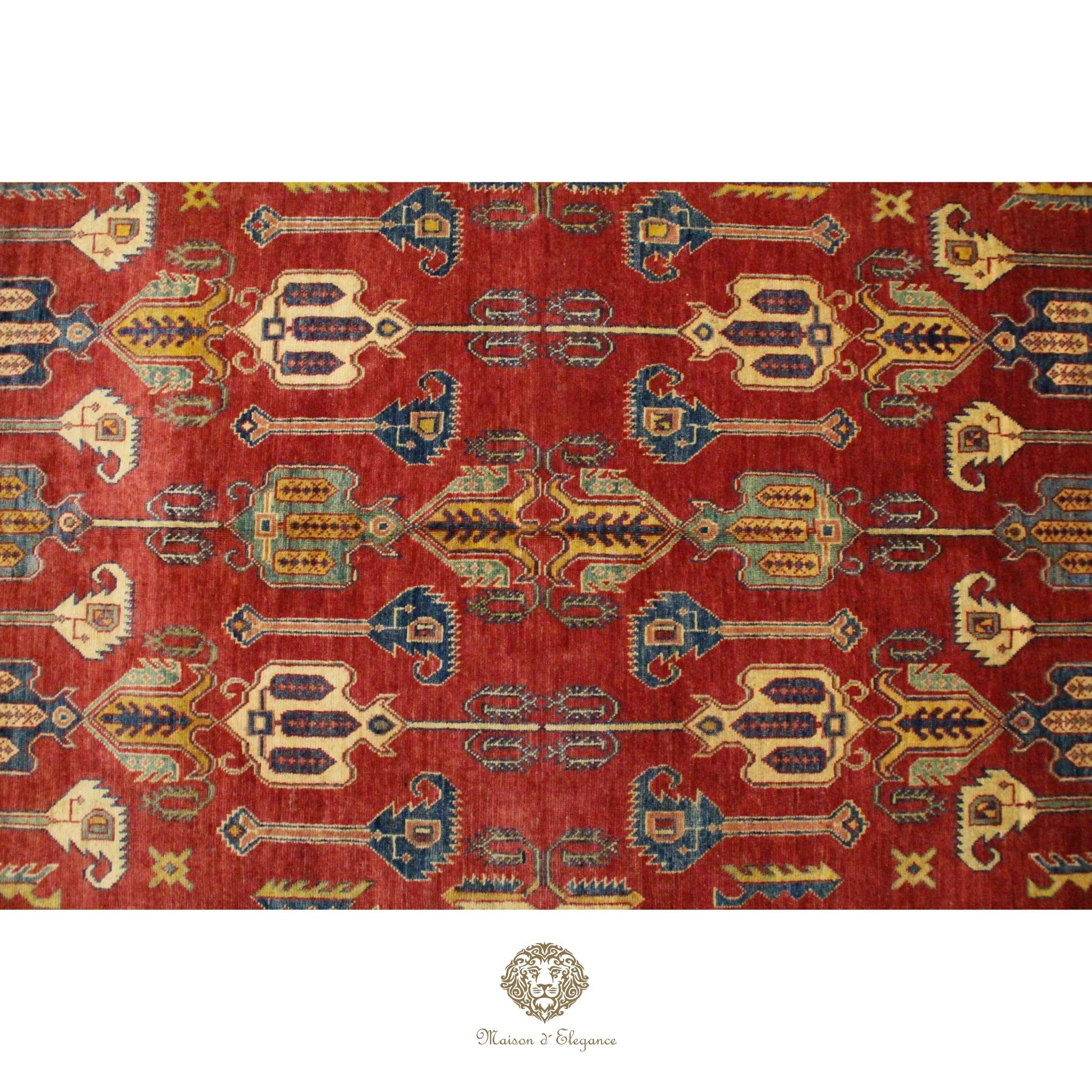 Decorative rug with intricate patterns on a red background