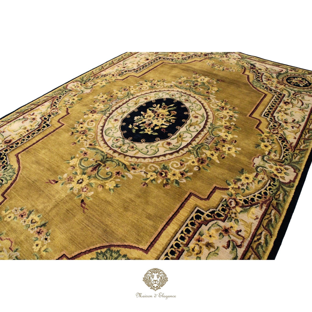 Decorative gold rug with intricate patterns on a brown background