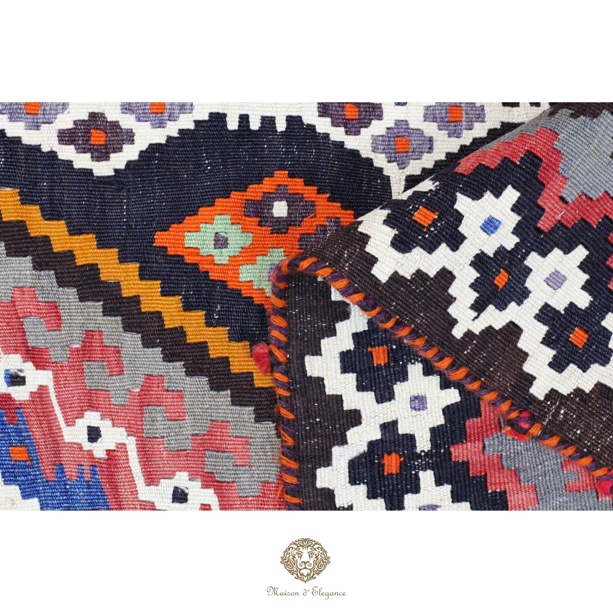 Close-up of a colorful woven textile with geometric patterns on a white background.