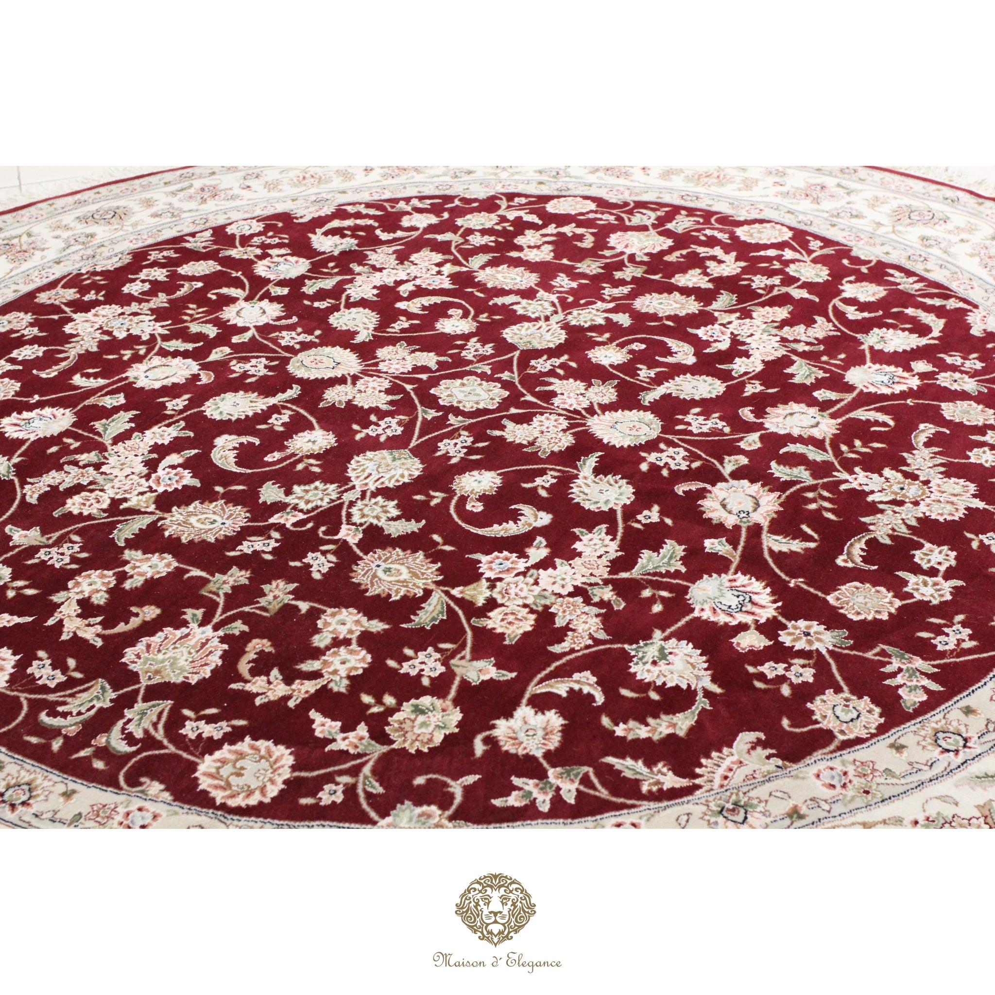 Round floral-patterned rug with red and beige colors on a red background