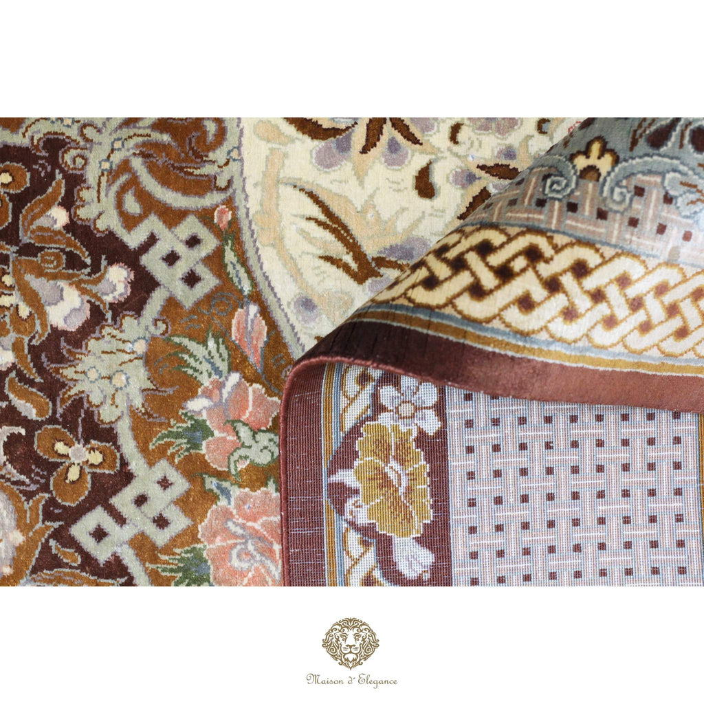 Close-up of a patterned rug with intricate designs on a white background.