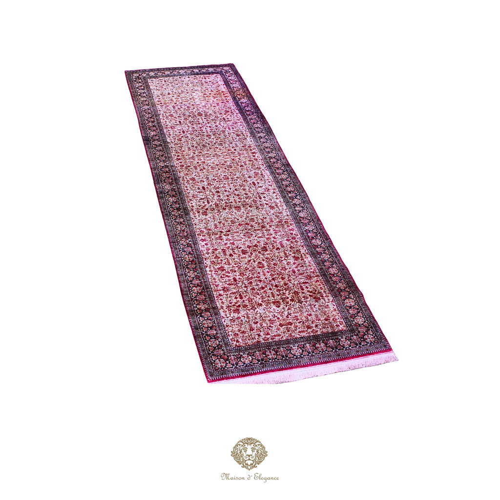 Long rectangular rug with intricate patterns on a white background