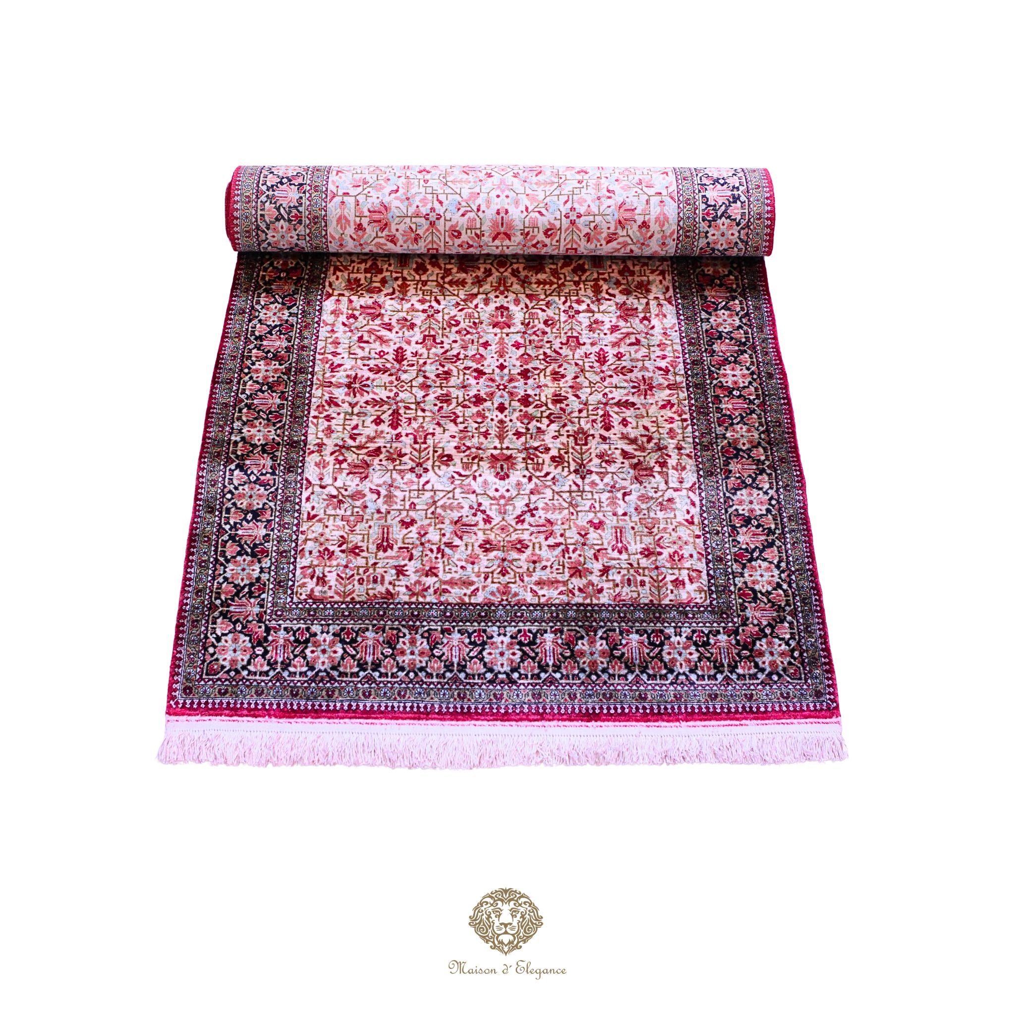 Roll of pink and red patterned fabric on a white background