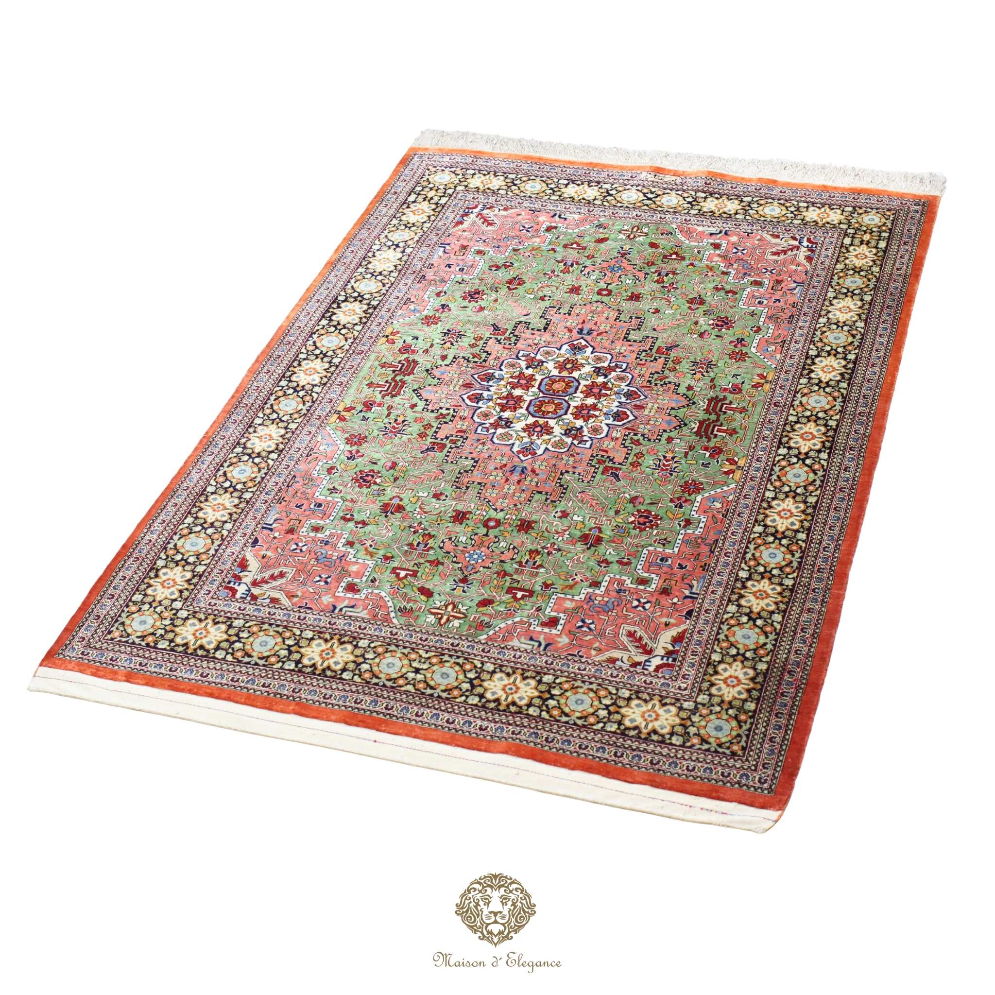 Decorative rug with intricate patterns on a green background
