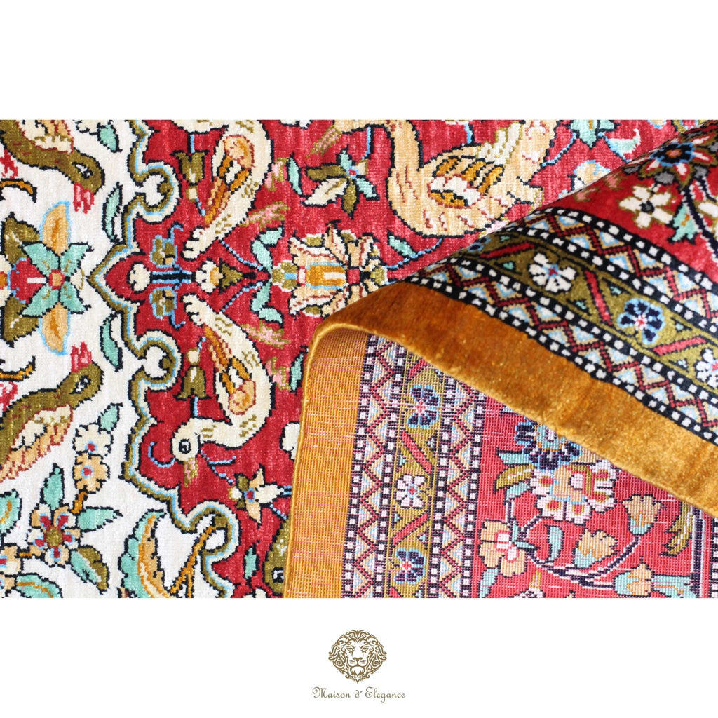 Close-up of a patterned fabric with intricate designs on a white background