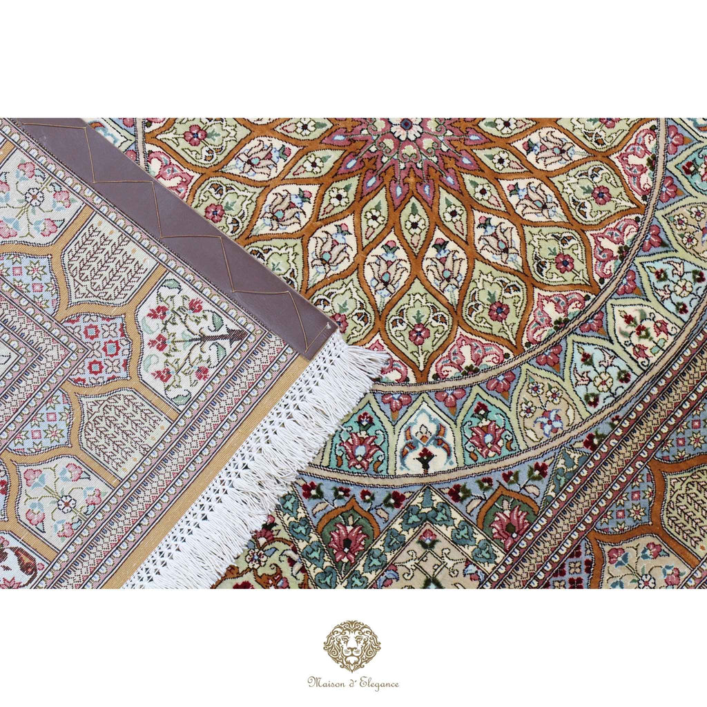 Decorative rug with intricate patterns and a brand logo at the bottom.