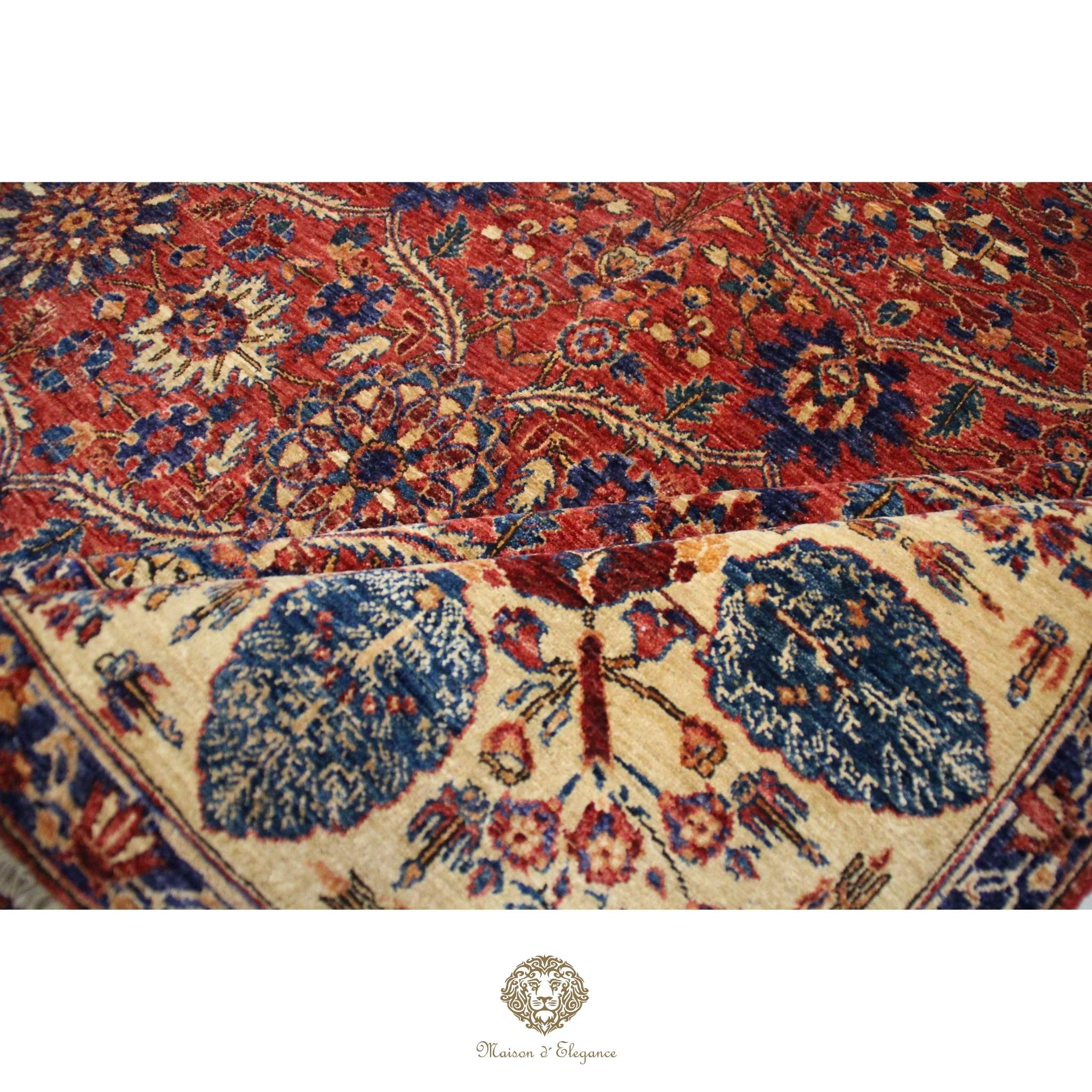 Close-up of a patterned rug with intricate designs on a red background