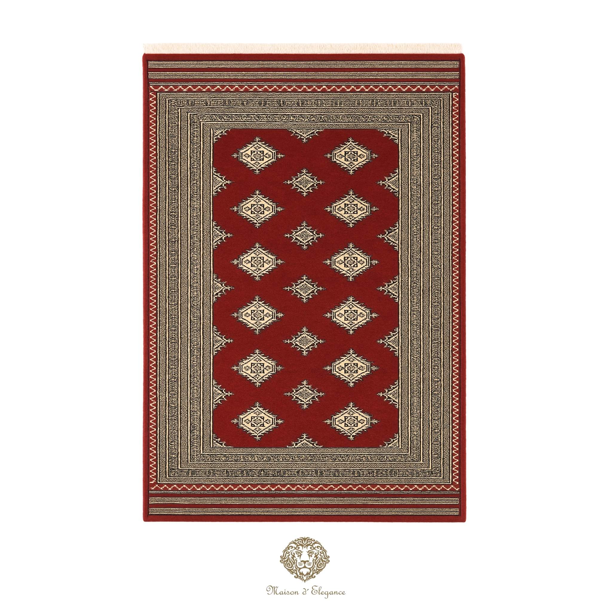 Red and beige patterned rug with a brand logo at the bottom right corner on a white background