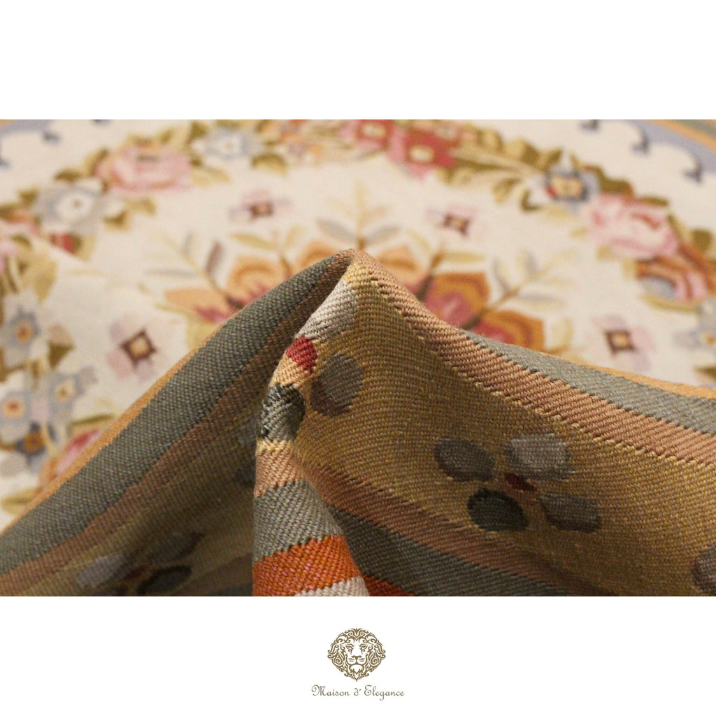 Close-up of a textured French Aubusson with a floral pattern in the background