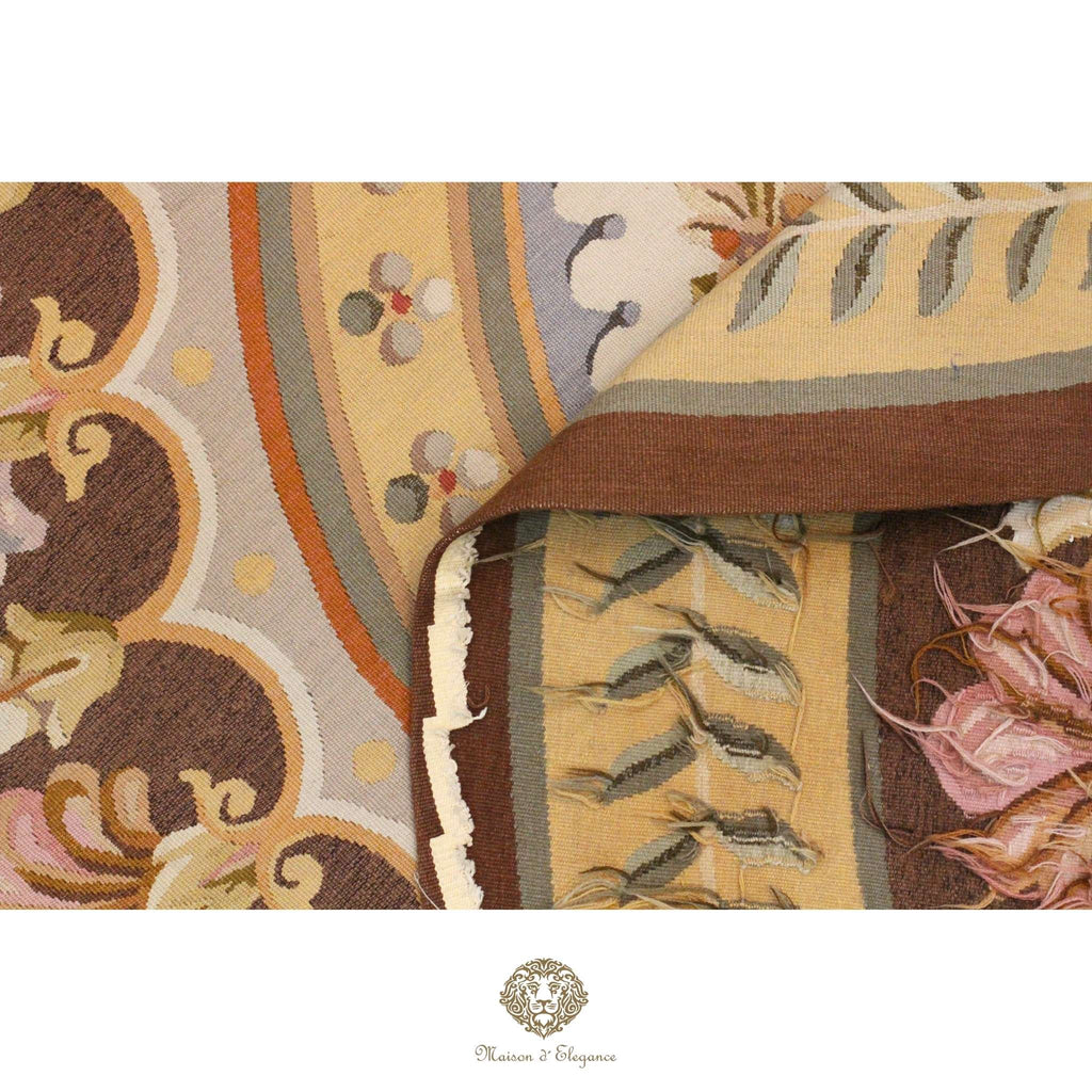 Close-up of a patterned of French Aubusson with intricate designs on a brown background