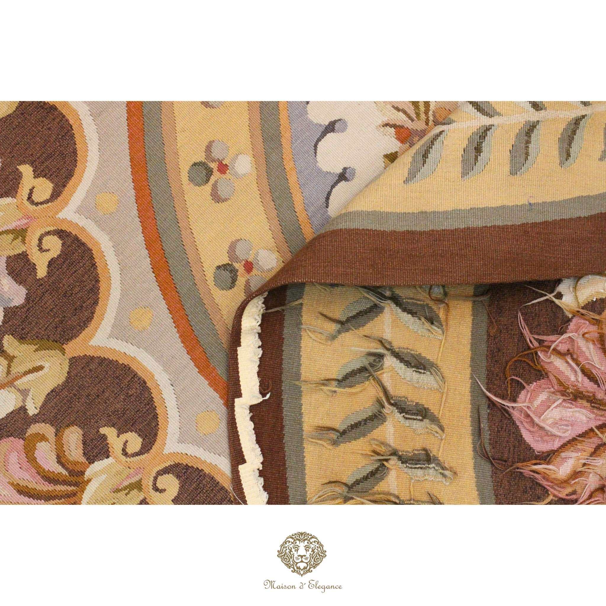 Close-up of a patterned of French Aubusson with intricate designs on a brown background