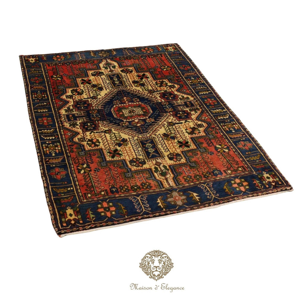 Decorative rug with intricate patterns on a white background, featuring the Maison d'Elegance logo.
