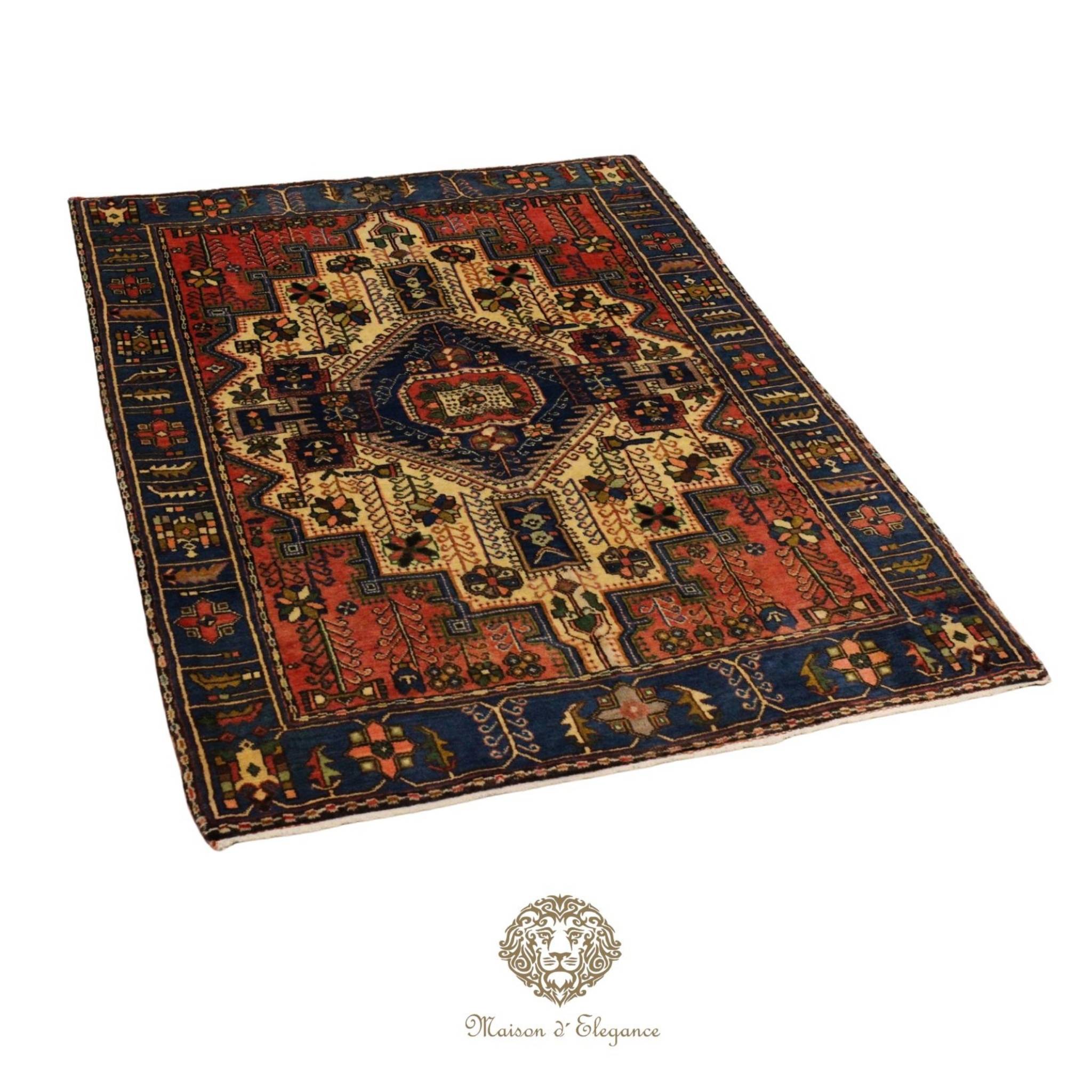Decorative rug with intricate patterns on a white background, featuring the Maison d'Elegance logo.