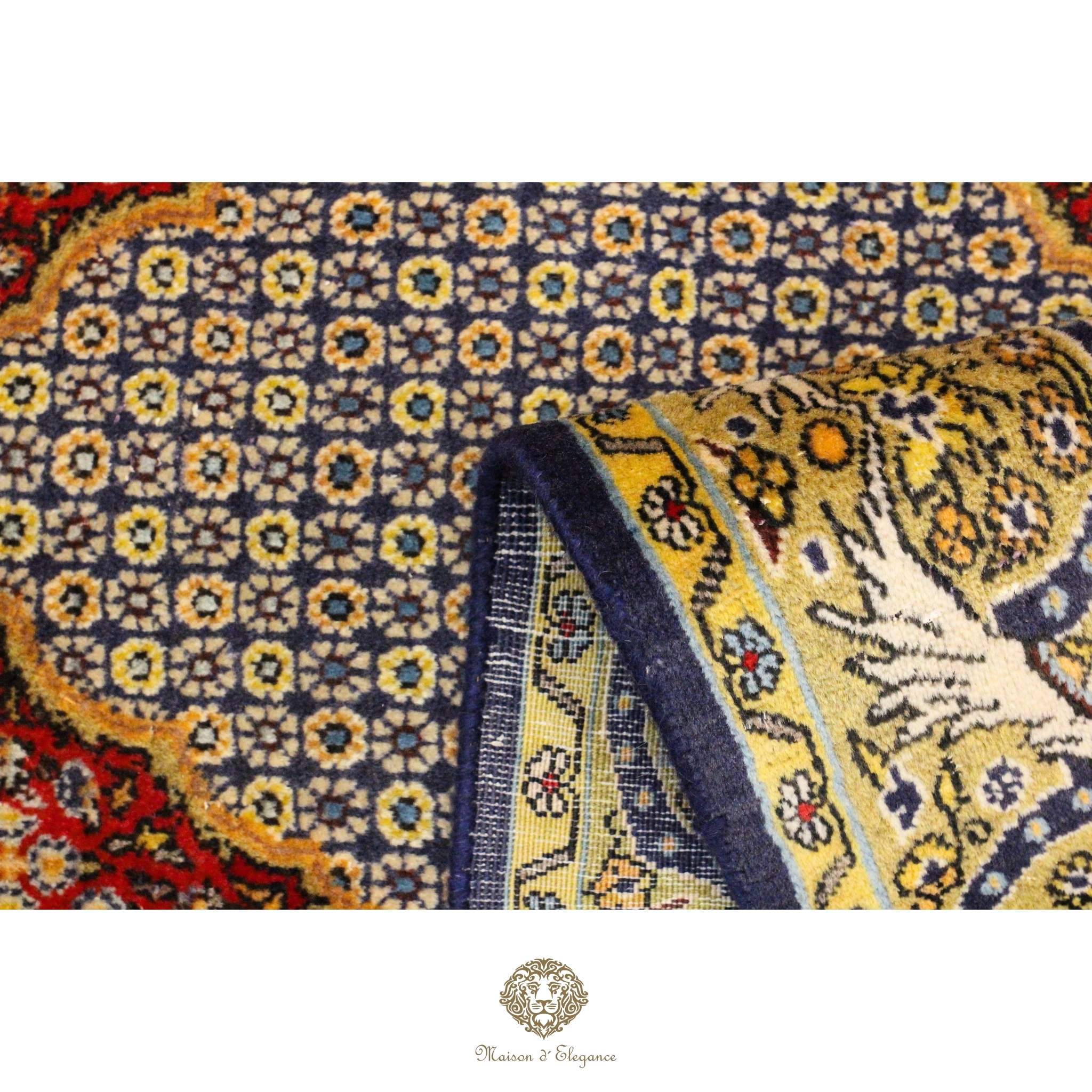 Close-up of a patterned rug with intricate designs and vibrant colors.