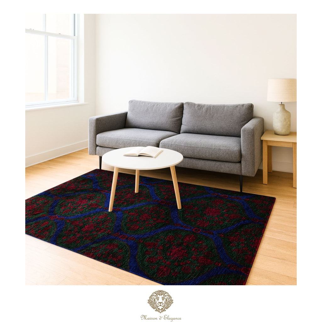 Living room with a patterned rug, gray sofa, and round coffee table.