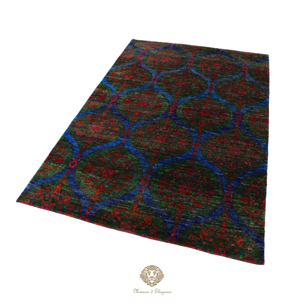 Patterned rug with red and blue design on a white background