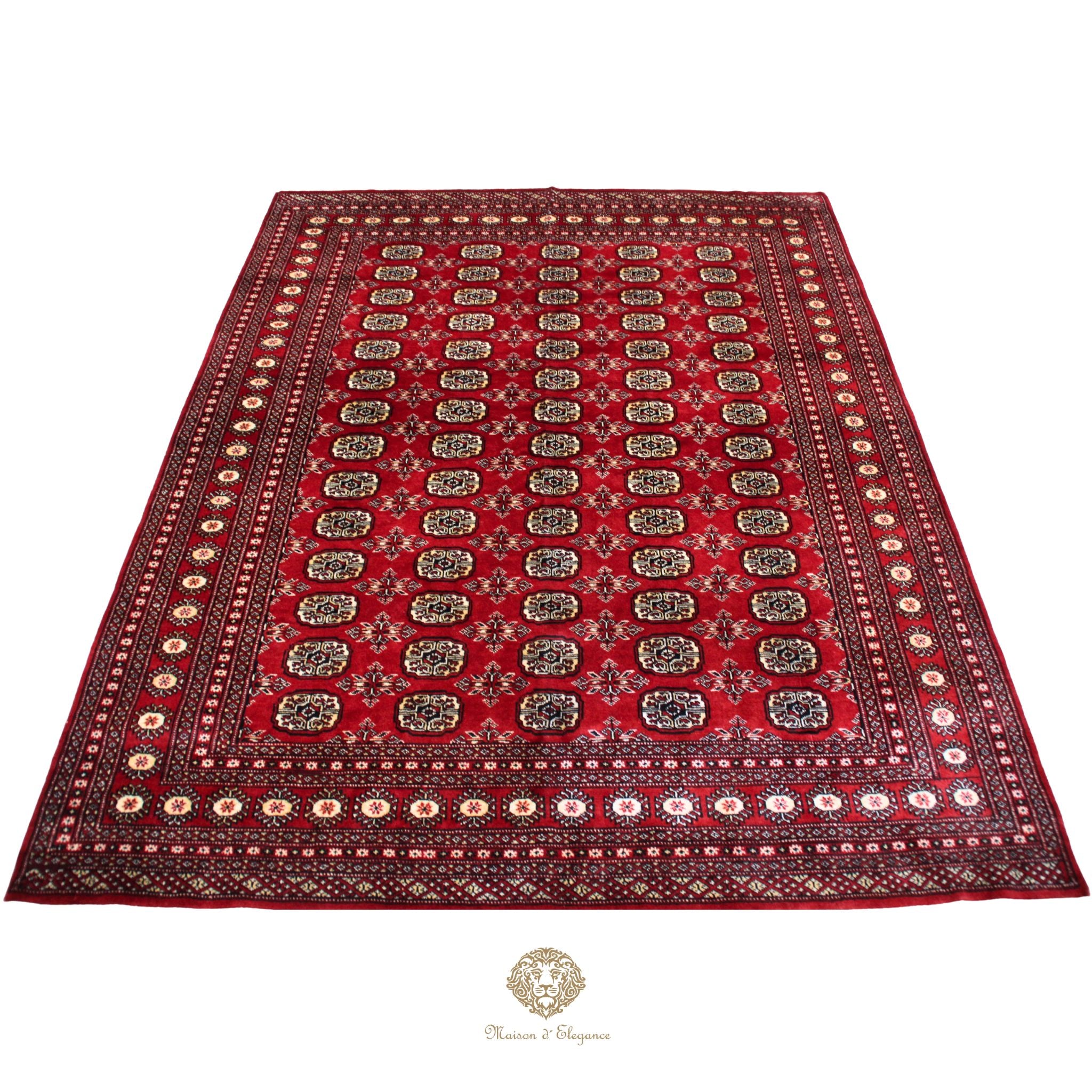 Red patterned rug with intricate designs on a white background