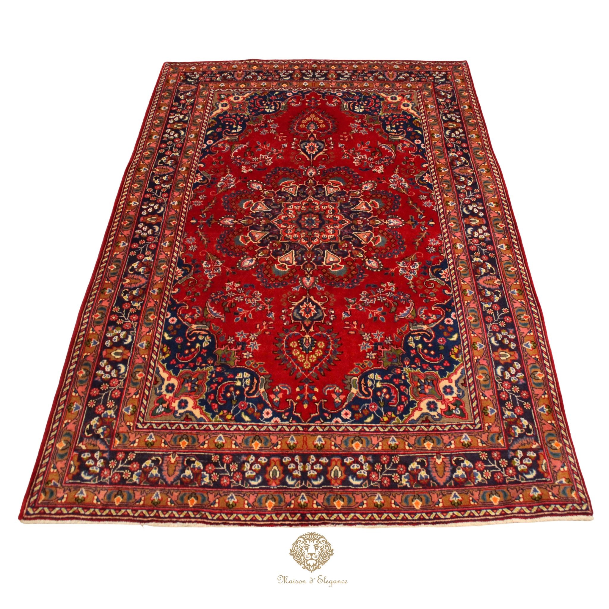 Decorative red rug with intricate patterns on a white background