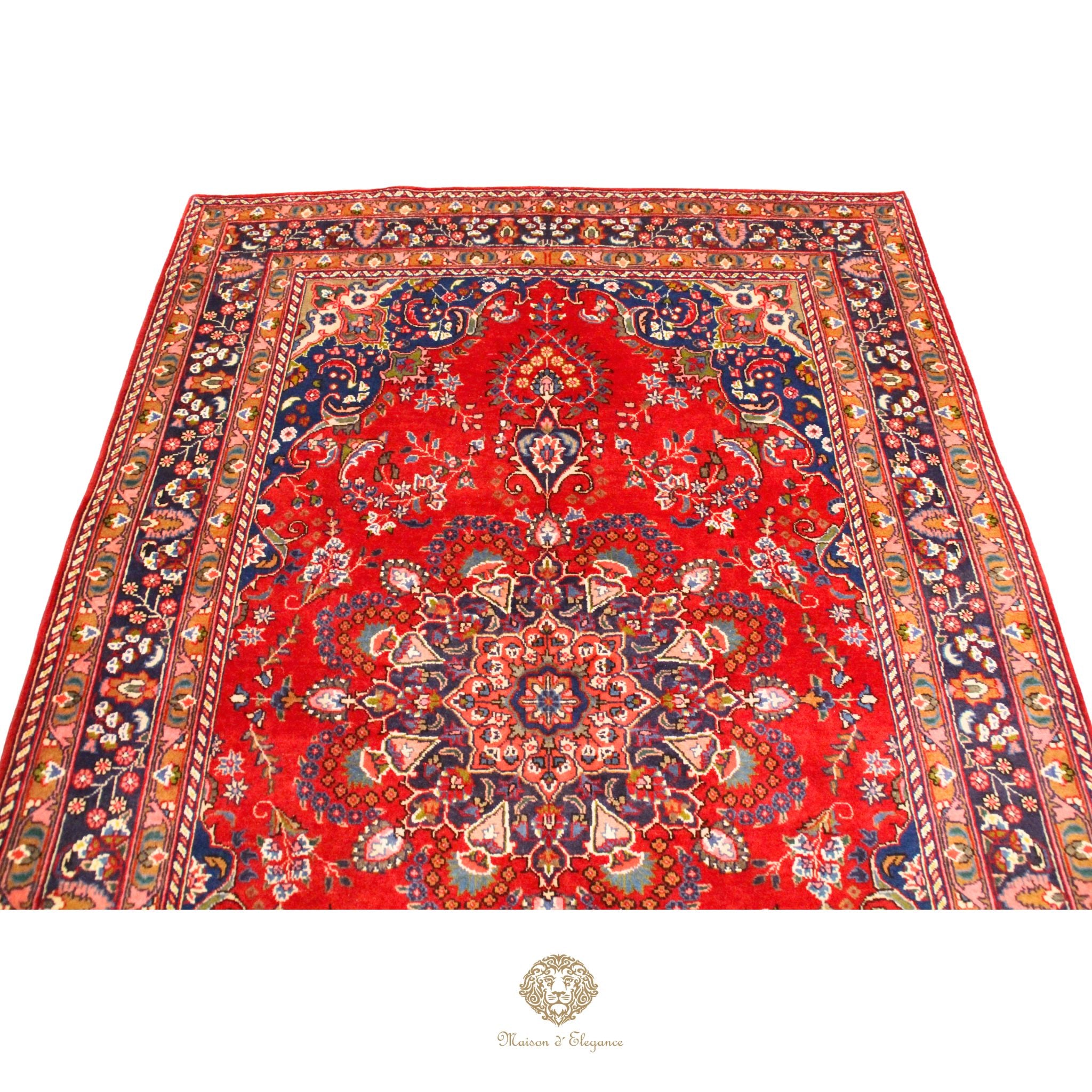Decorative red rug with intricate patterns on a white background