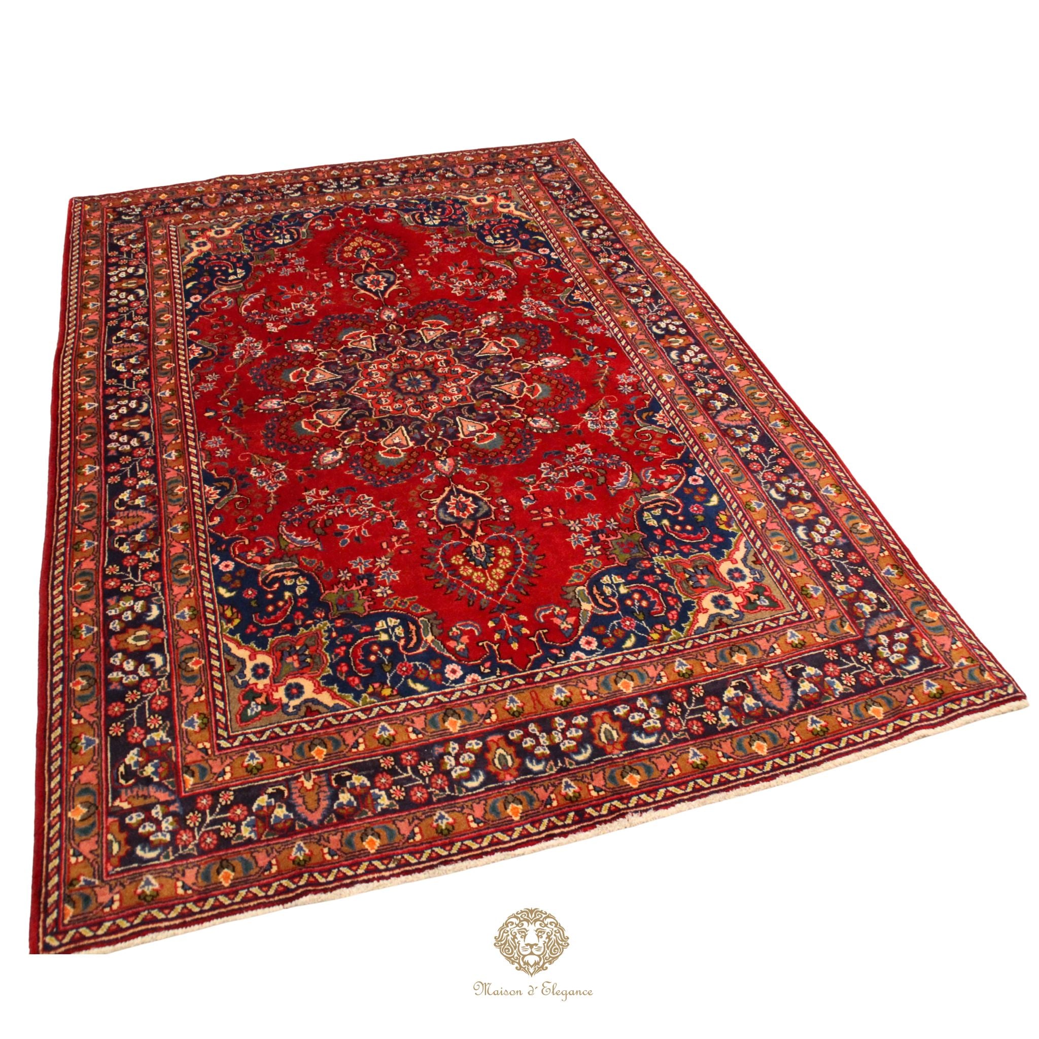 Decorative red and blue patterned rug on a white background