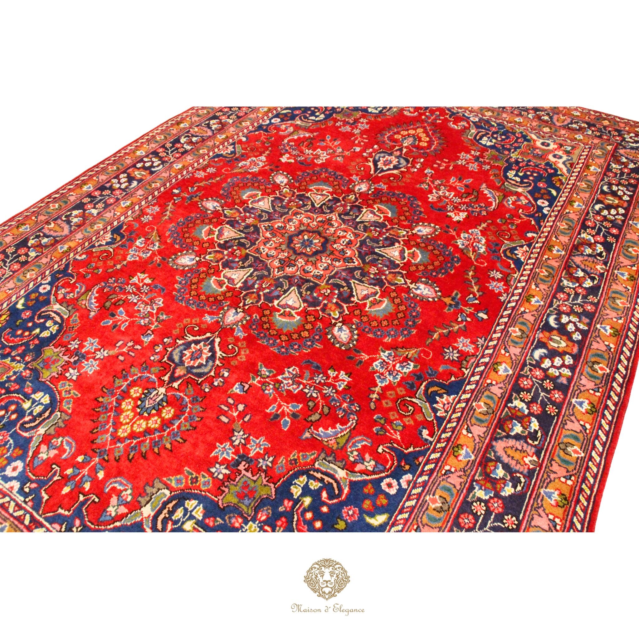 Decorative red rug with intricate patterns on a white background