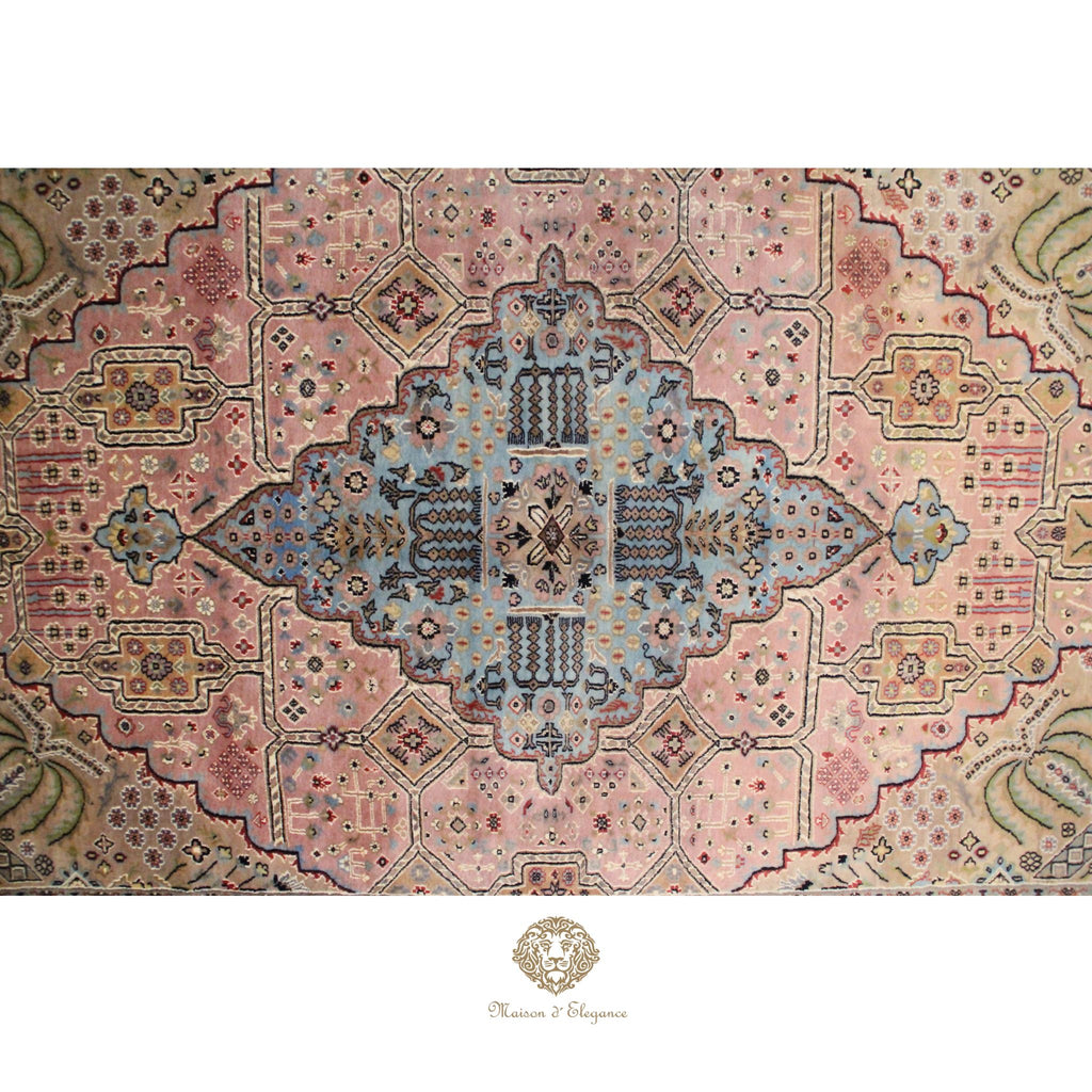 Decorative rug with intricate patterns and colors on a rosa background