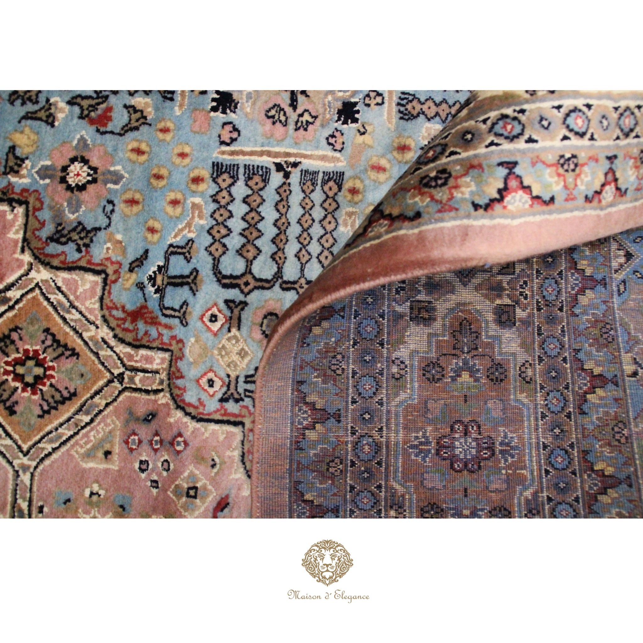 Close-up of a patterned rug with intricate designs and colors.